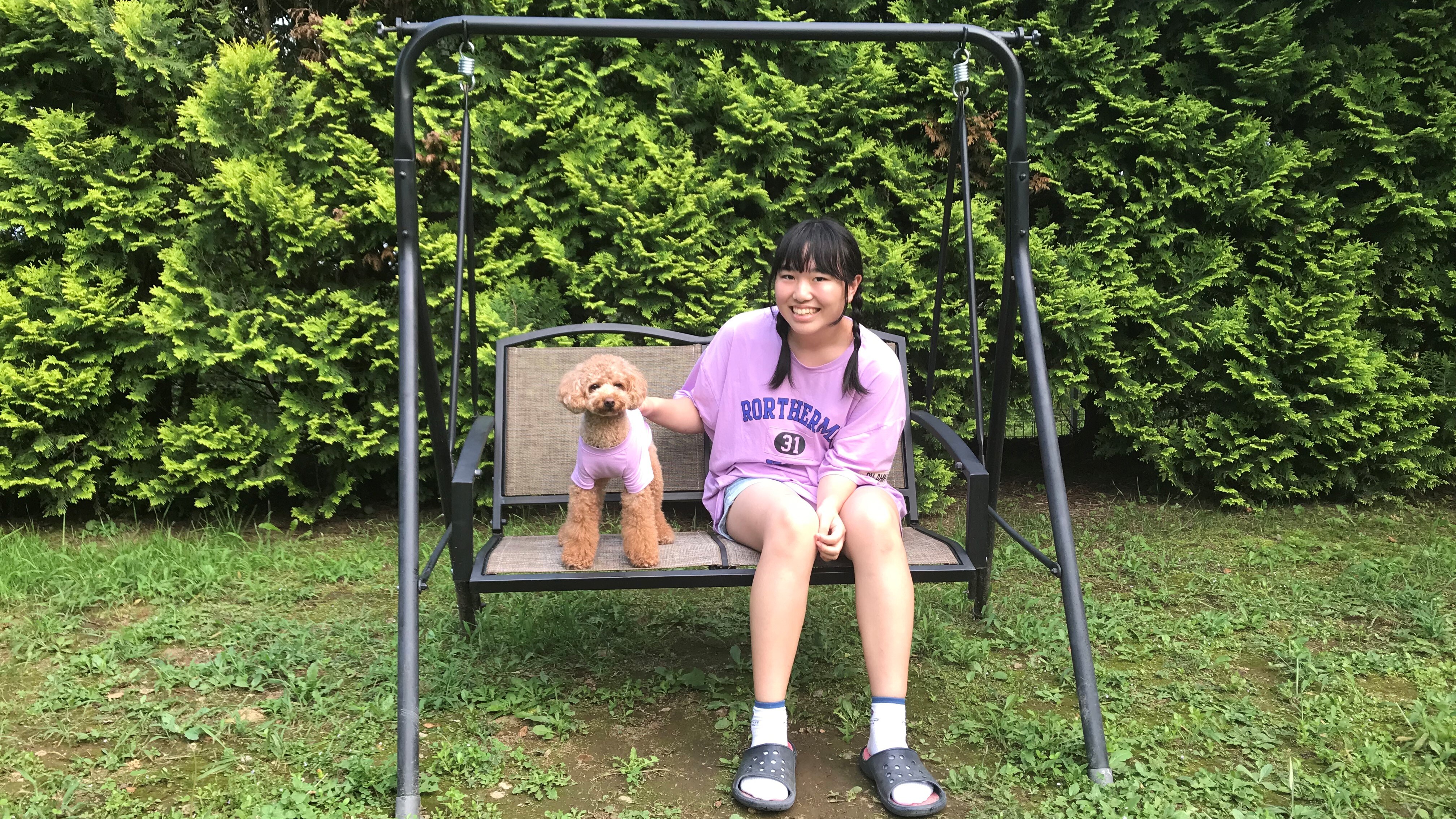On the swing at the dog run