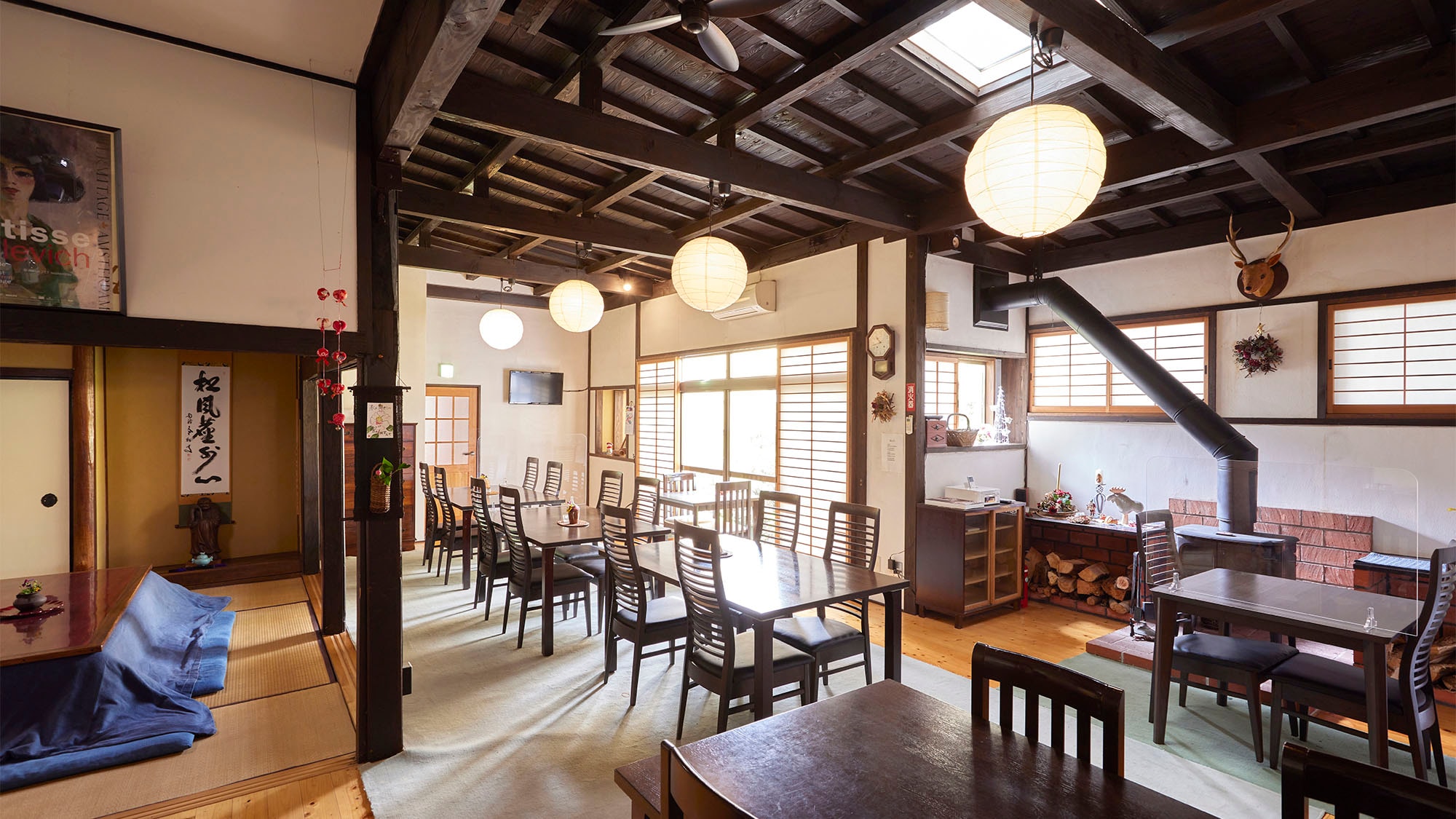 ・Breakfast in a Japanese-modern dining room equipped with a wood stove