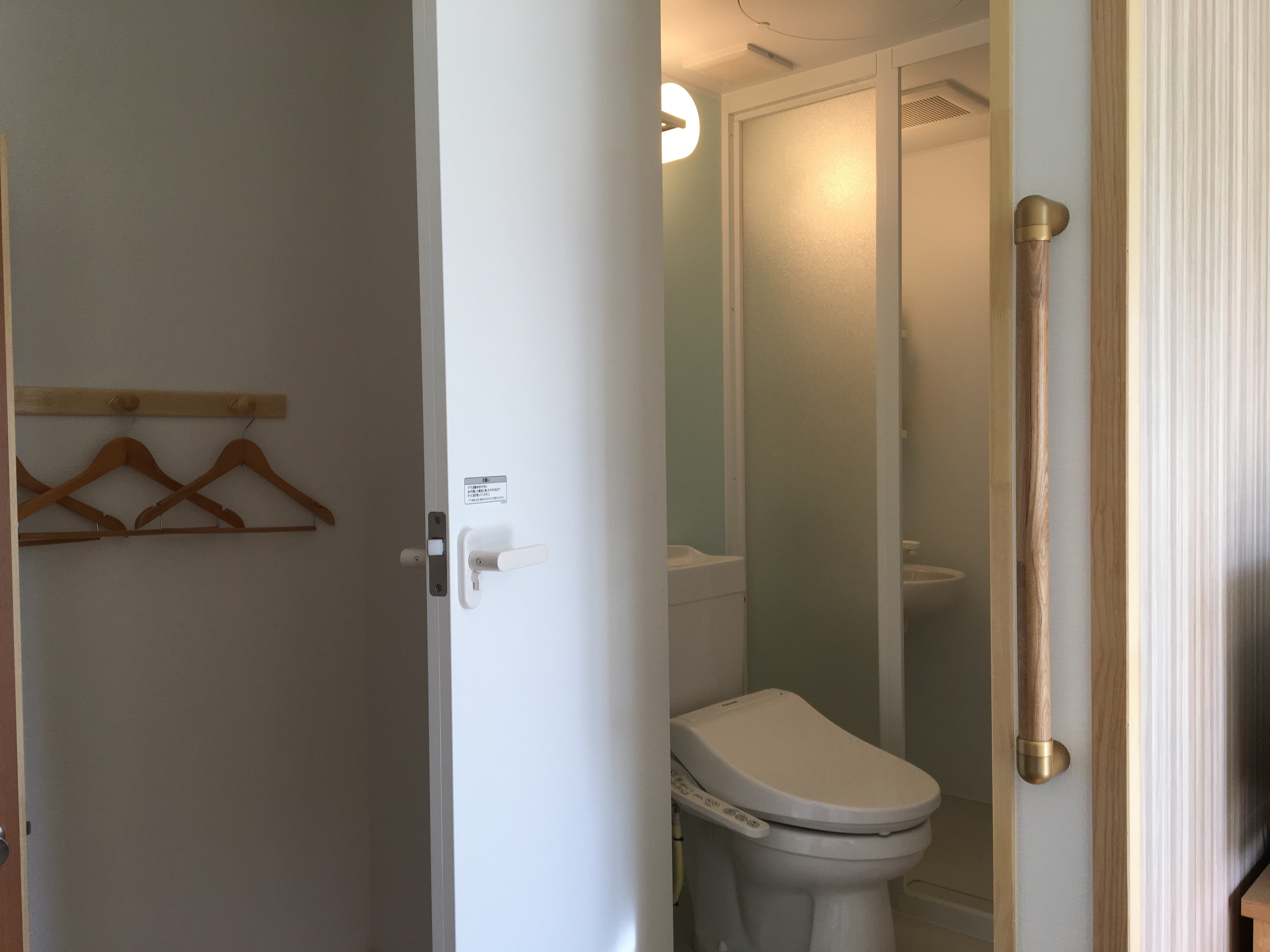 Stylish twin room with shower and toilet