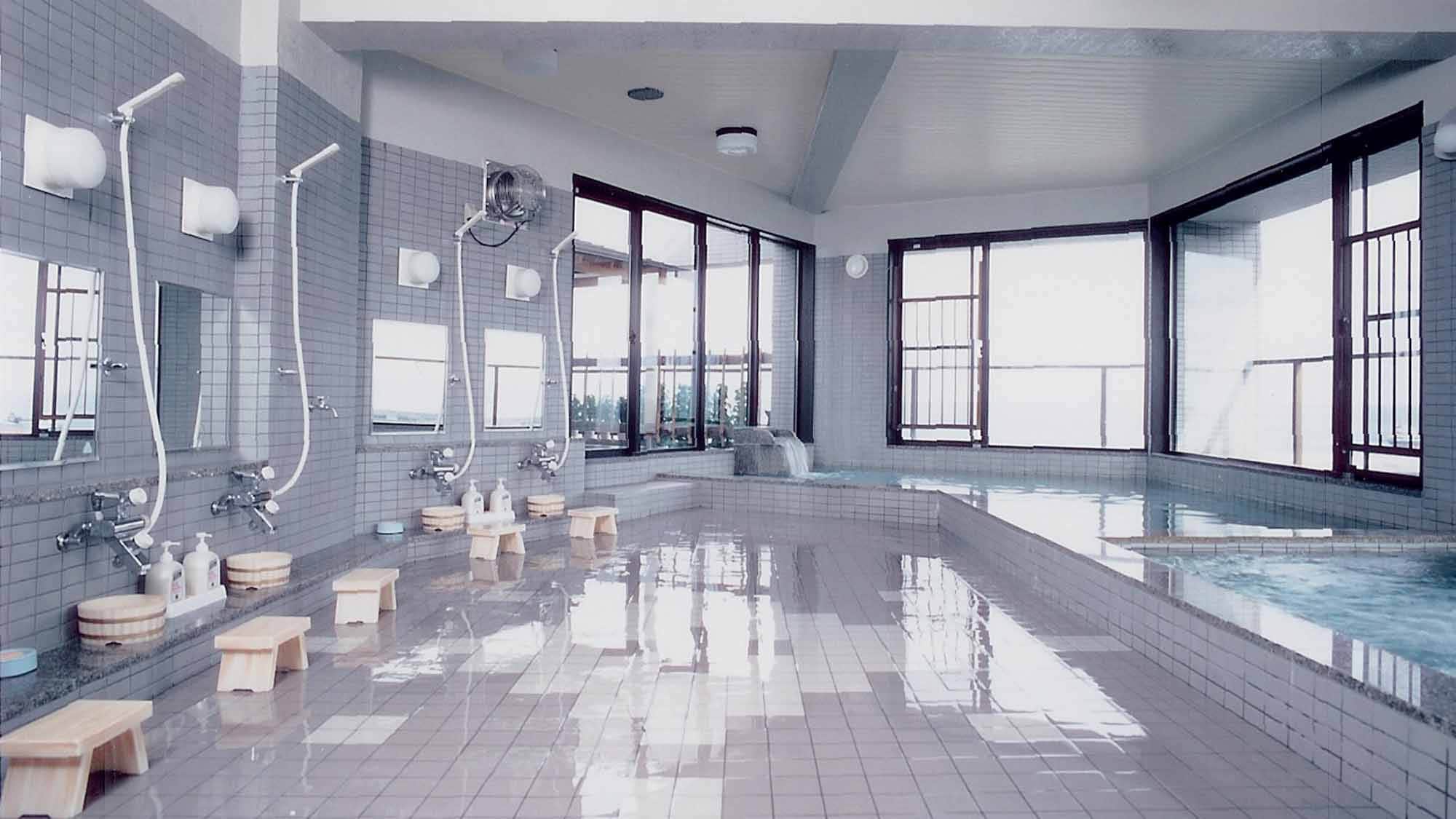 * [Large public bath] A large public bath with a panoramic view of Rishiri Fuji towering over the Rebun Sea.