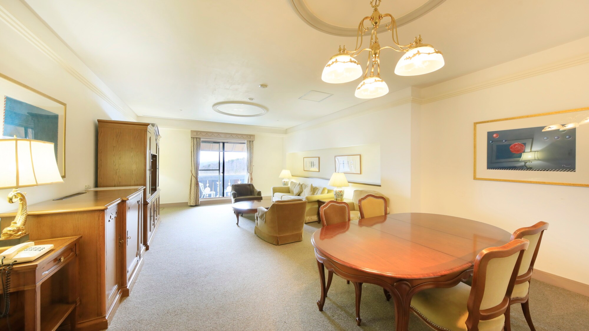 [Western-style Suite] Spacious living room equipped with a sofa and dining table