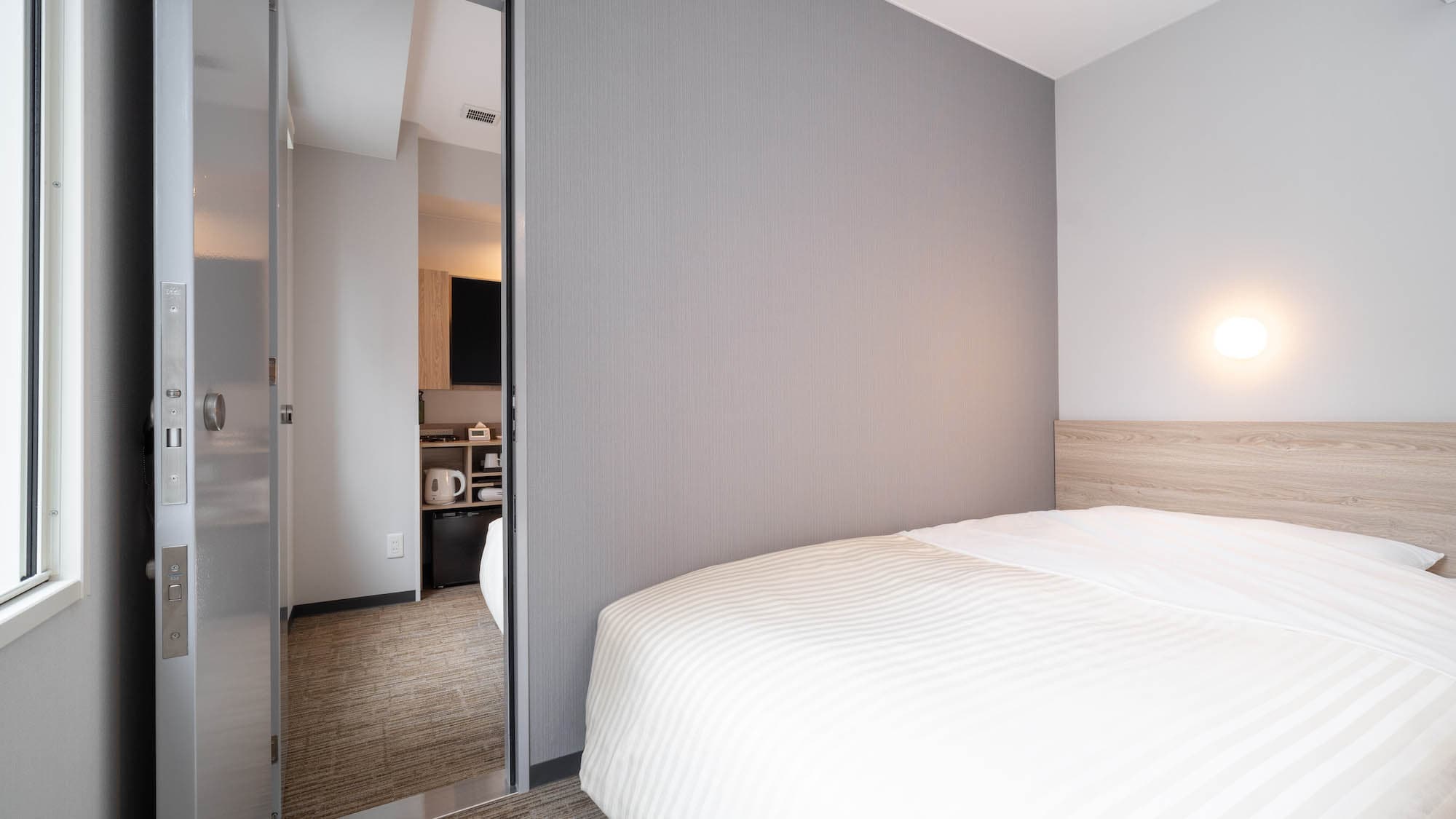 This room has two rooms with a door between them.