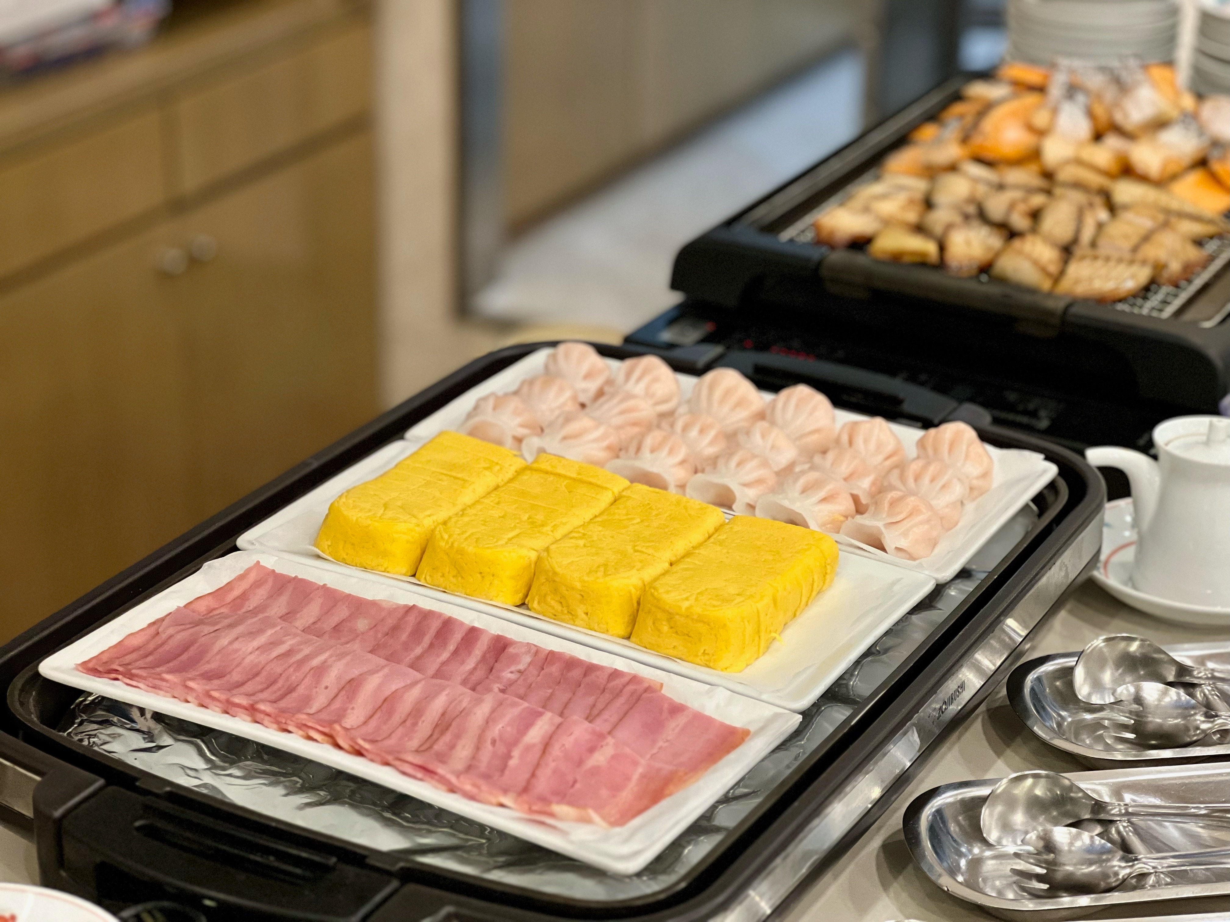 Breakfast example (bacon, rolled omelet, shrimp shumai)