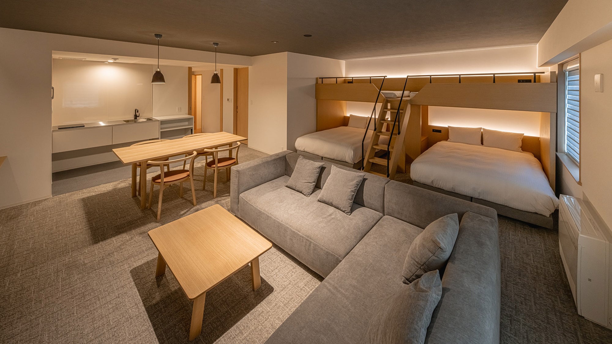 With a mini kitchen, dining area, and living space, you can feel at home. | Family Suite