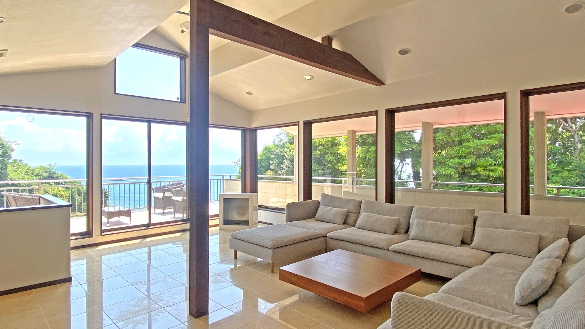Living area: Large sofa, 75-inch TV, and more