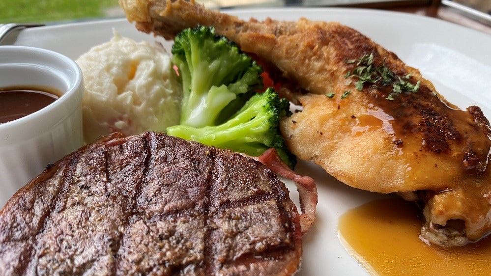 Beef fillet with bacon-wrapped steak and roasted garlic chicken