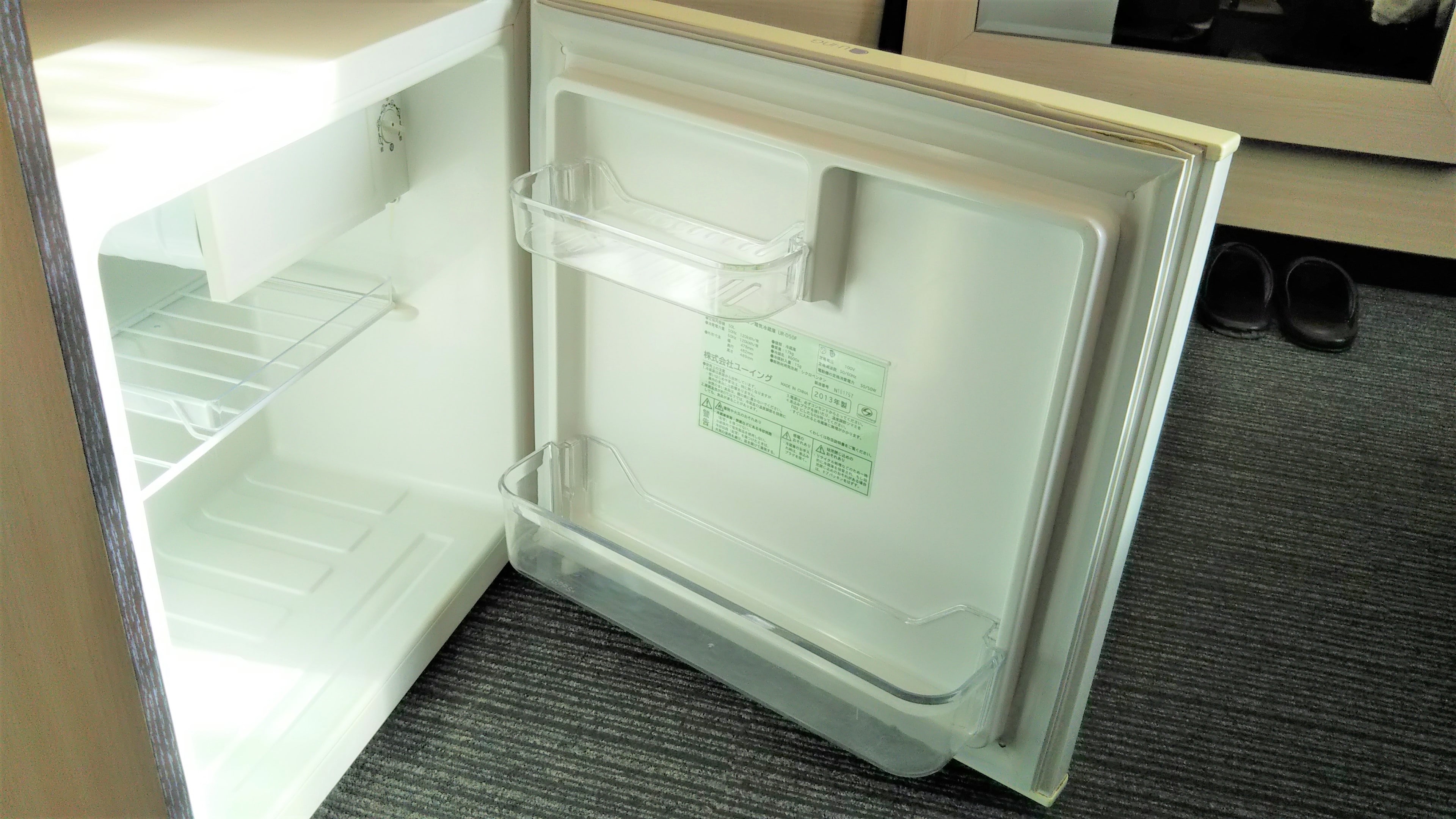 Common amenities in the guest rooms: Refrigerator (empty)