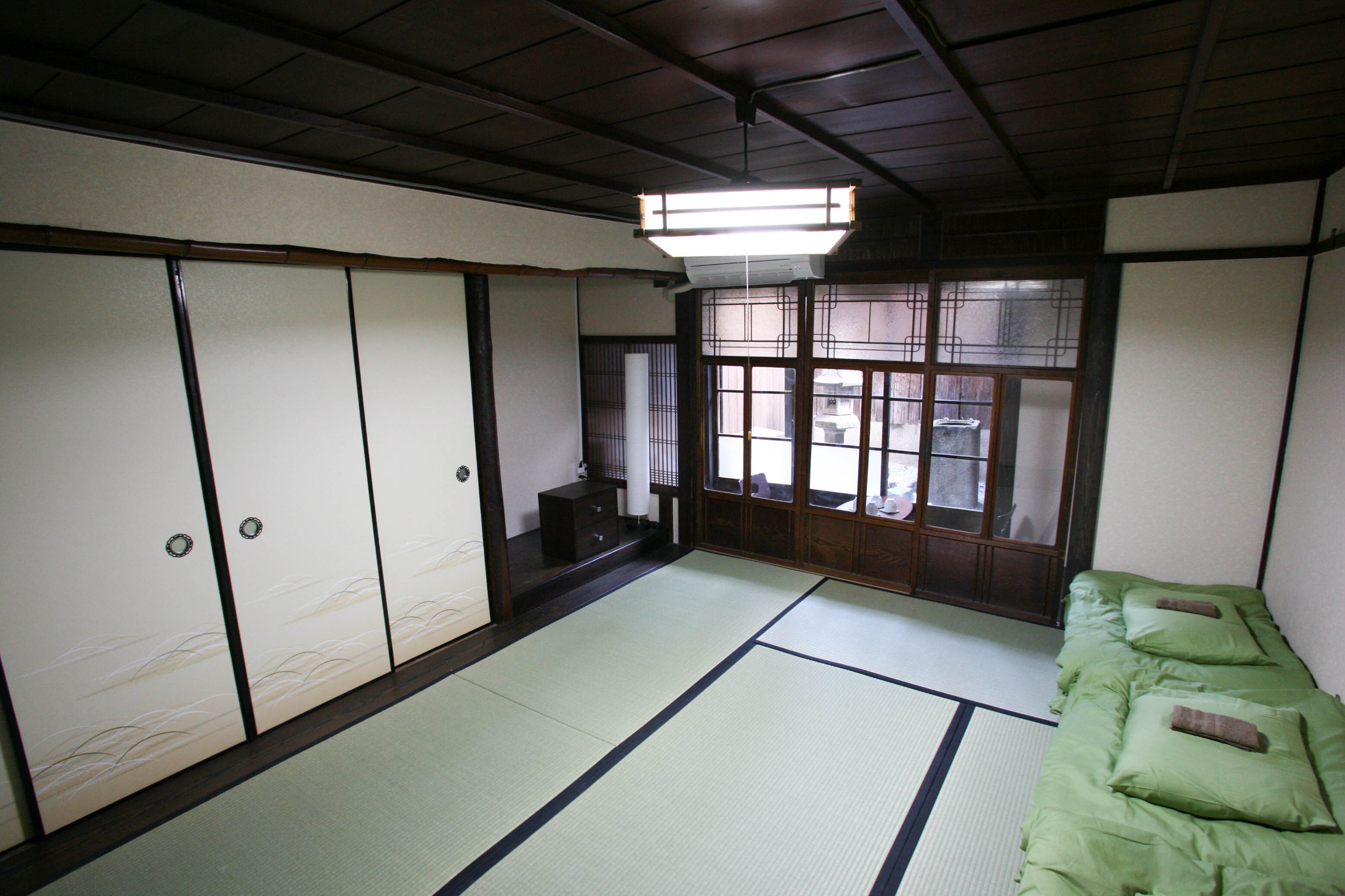 Room 102 is a spacious and relaxing Kyoto-style room with 8 tatami mats and a small garden.