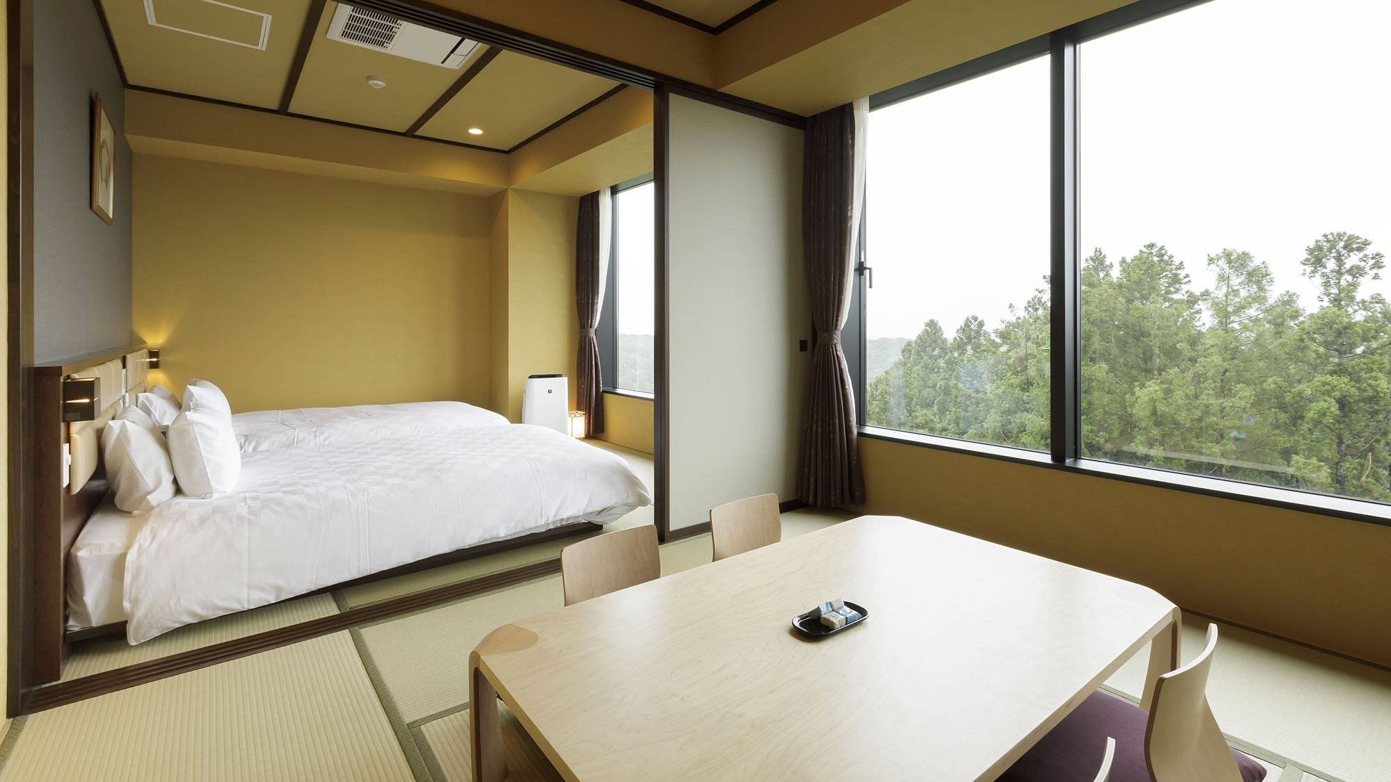 Superior A [Japanese-style room + Japanese-style room twin] A bedroom with two Japanese-style beds on a tatami-matted floor and a Japanese-style room with a continuous room.