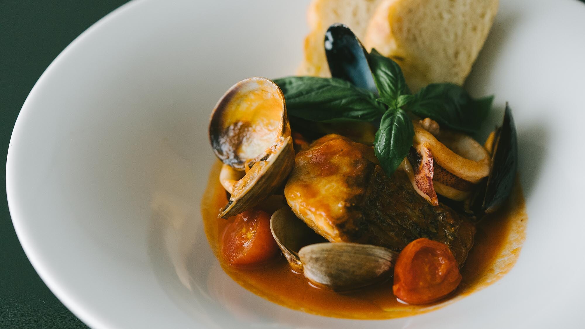 The soup, which is packed with the delicious flavors of tomatoes and seafood, is exquisite. Local fish zuppa di pesce [example]