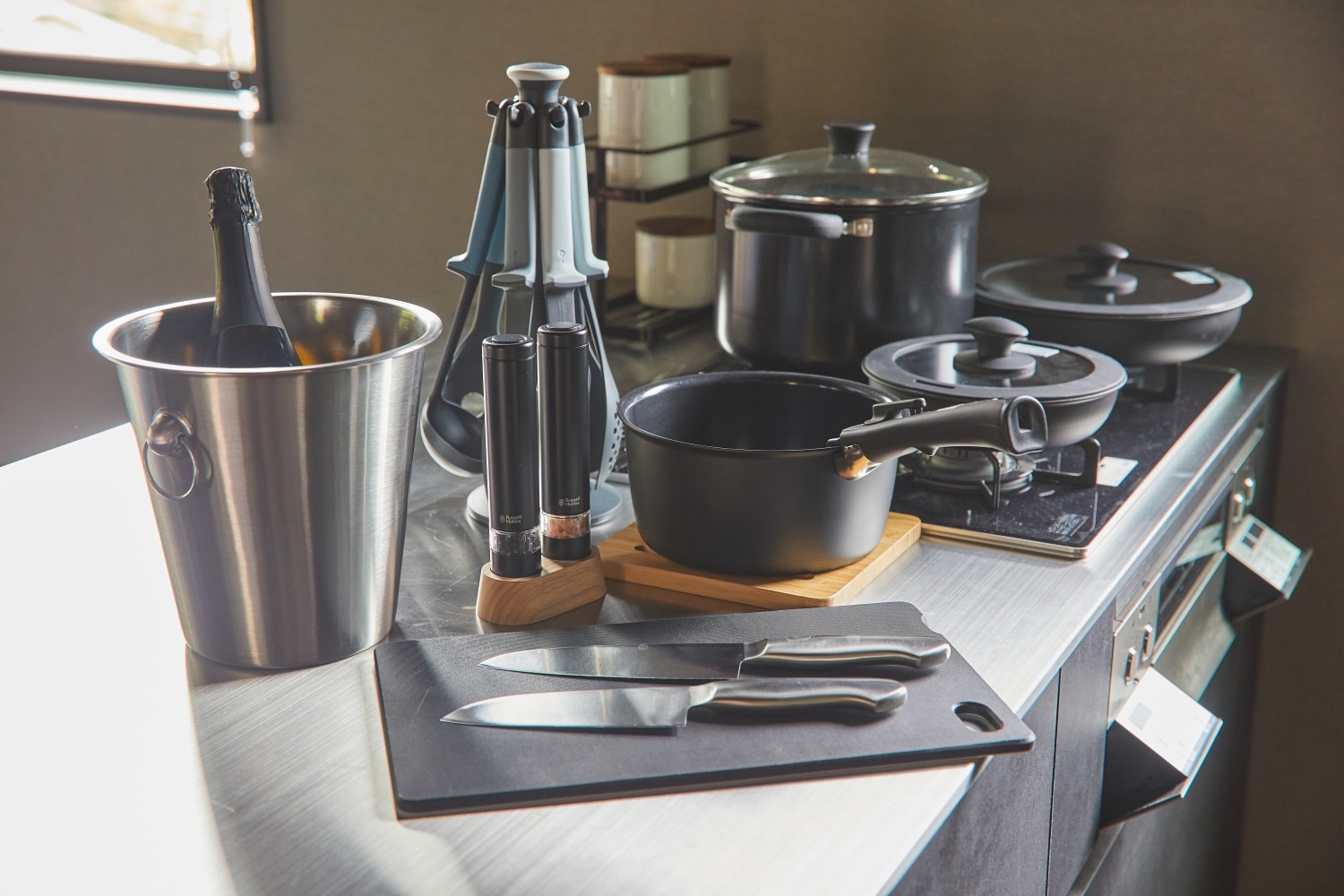 A full set of cooking utensils is provided.