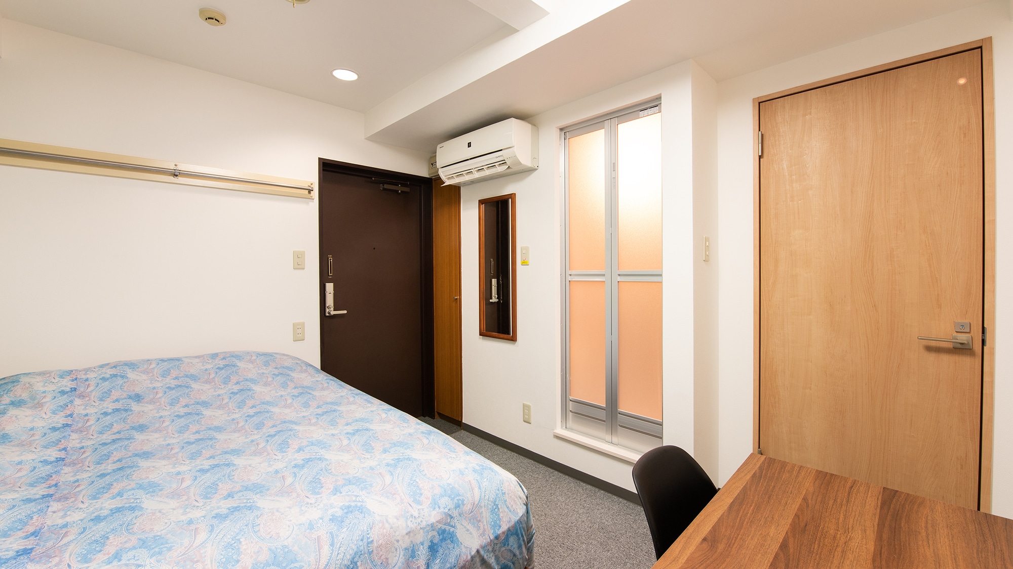 Entire guest room with separate bathroom and toilet. The wallpaper is cute too.