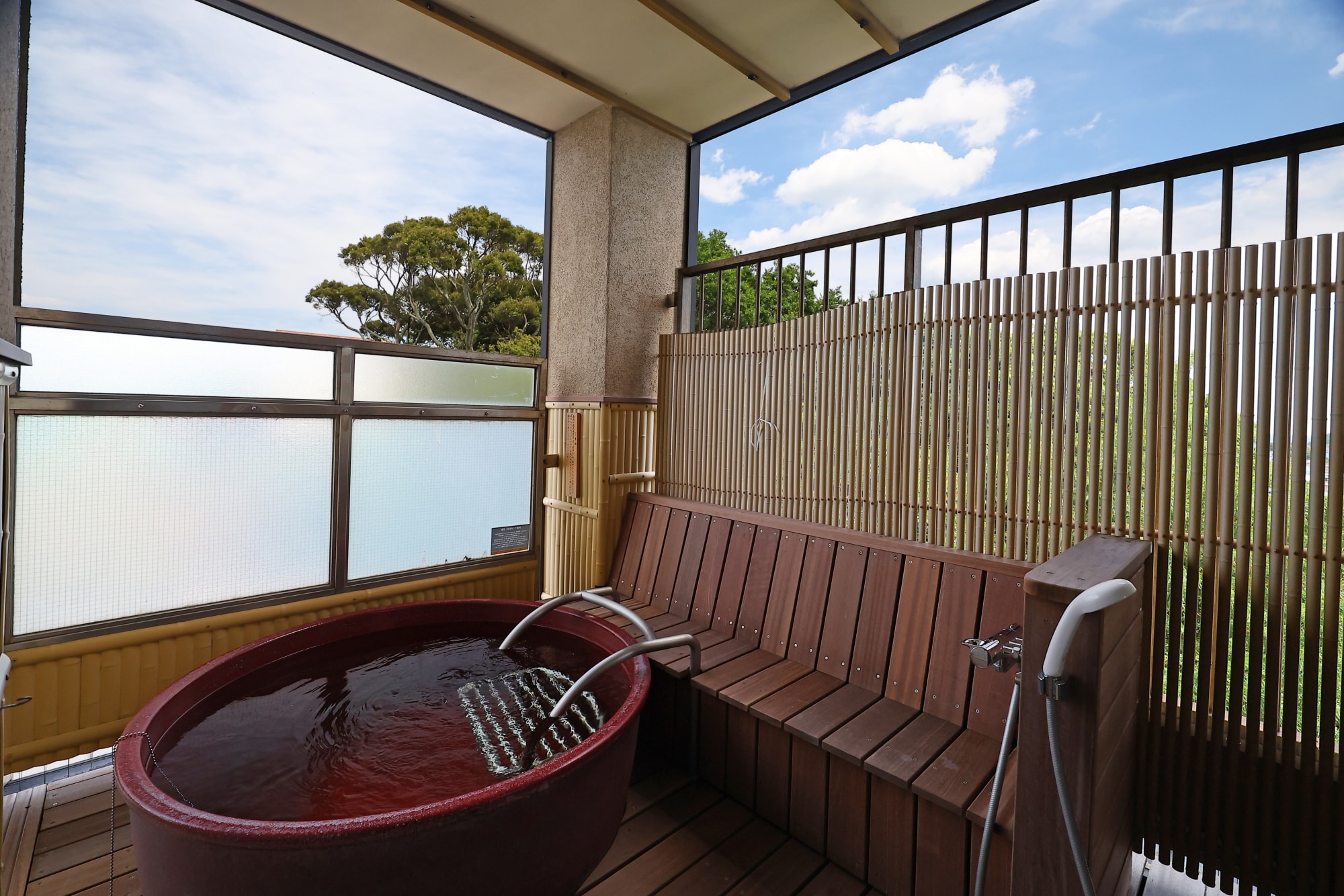 Barrier-free Japanese-Western room with an open-air hot spring bath (there is a footstool in the bathtub and a bench nearby)