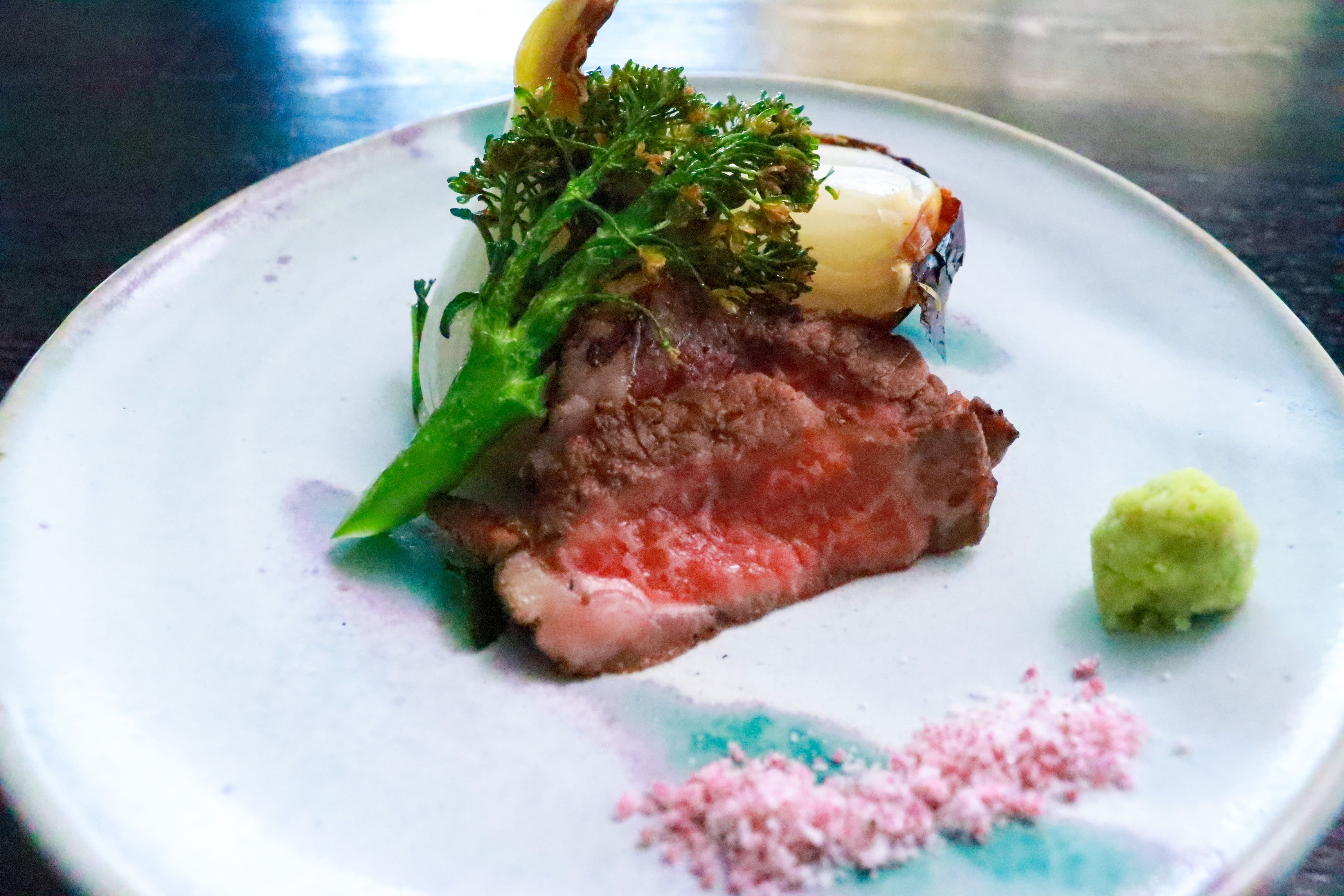 Charbroiled Wagyu beef and roasted new onions
