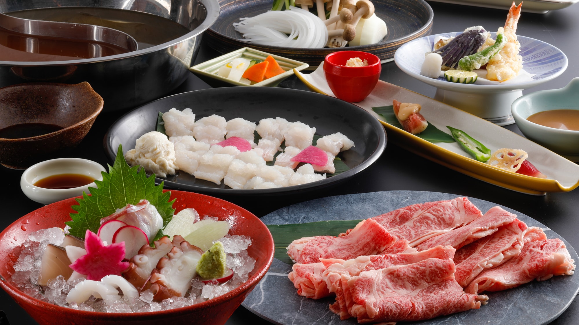 A course featuring a two-color hotpot filled with the bounty of Awaji Island's sea and mountains (image of dish)