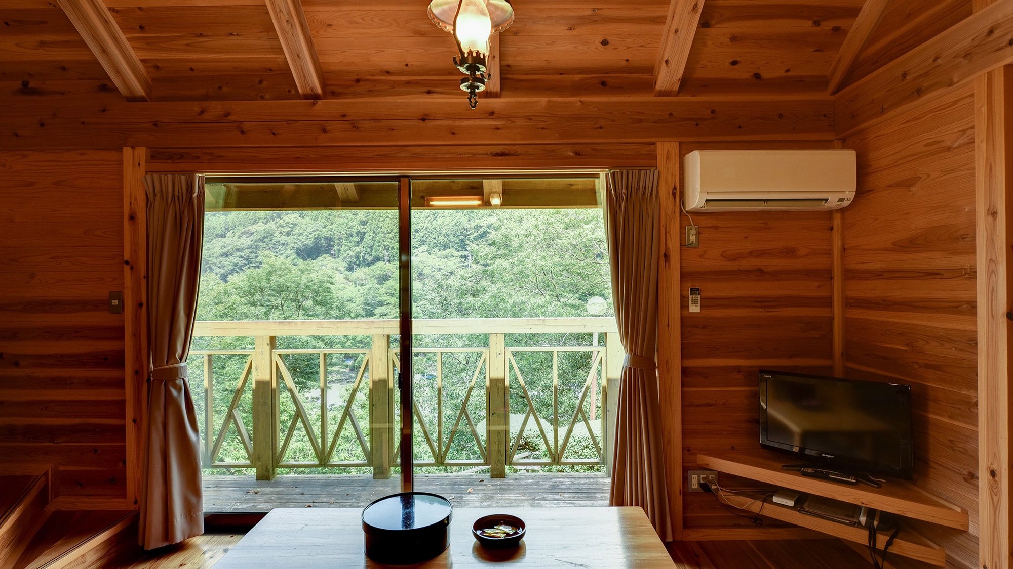 *Bungalow. Mountain and river views from the wooden deck.