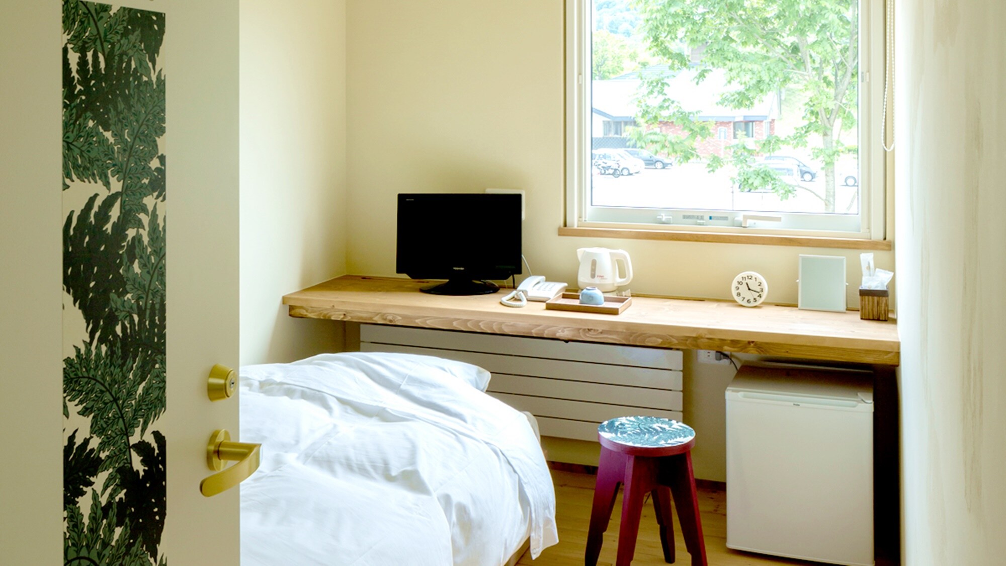 *Example of a guest room/Single room - A room with a comfortable wooden feel, flooring and a Japanese-style bed.