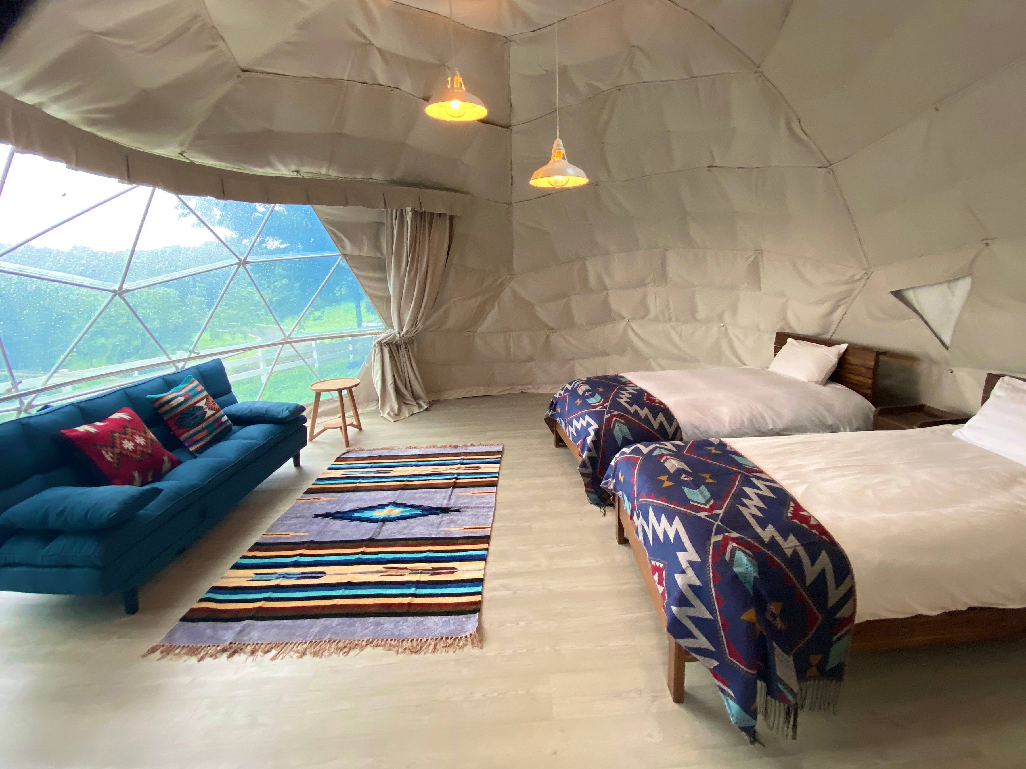 The colorful glamping tent has a lovely Indian-style color scheme. 3 beds + 1 sofa