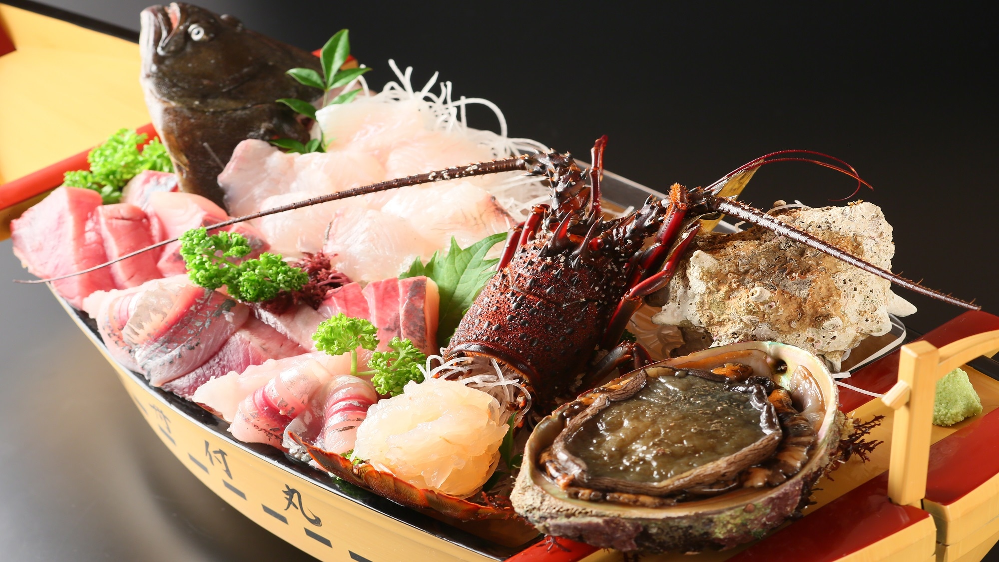 A greedy plan. A boat-shaped platter of abalone and spiny lobster.