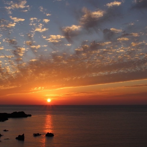 [Sunset] The view from all rooms is spectacular.