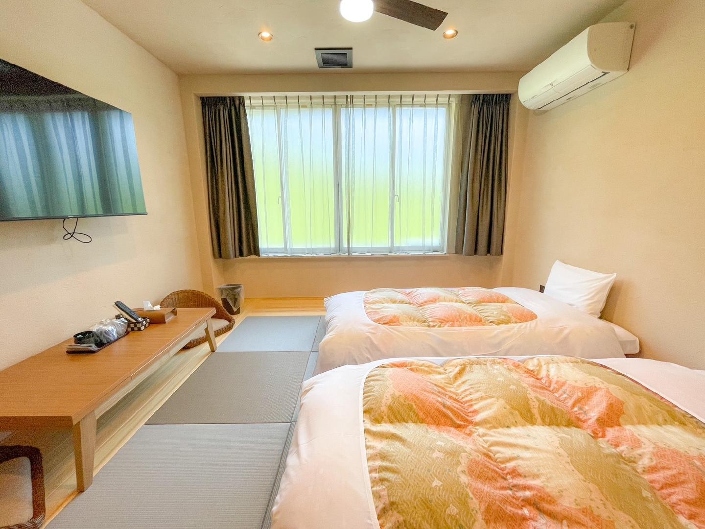 A modern Japanese-style room with a view of Mount Tsukuba