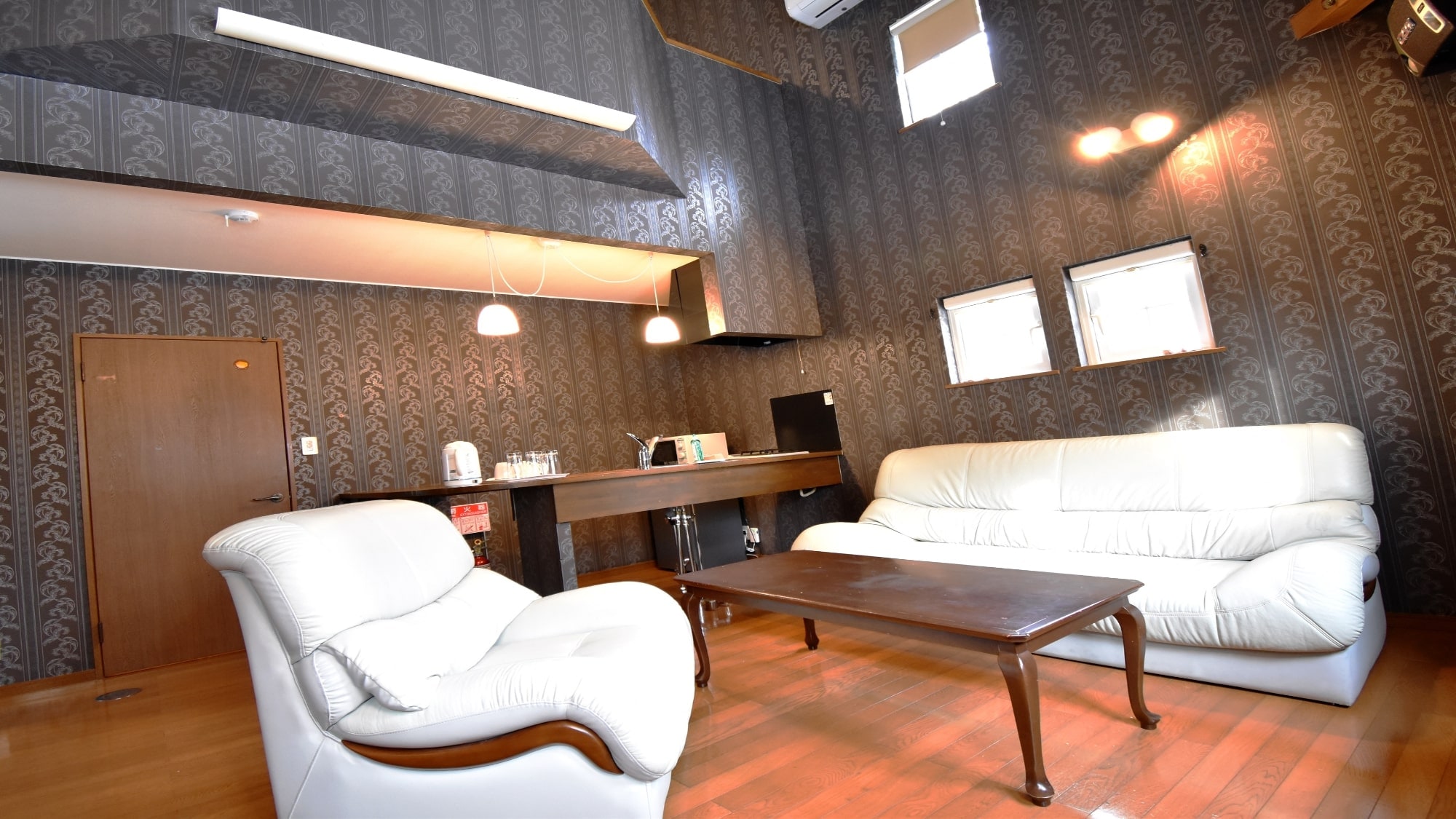 ・Family A: The living room is equipped with a sofa and a dining table.