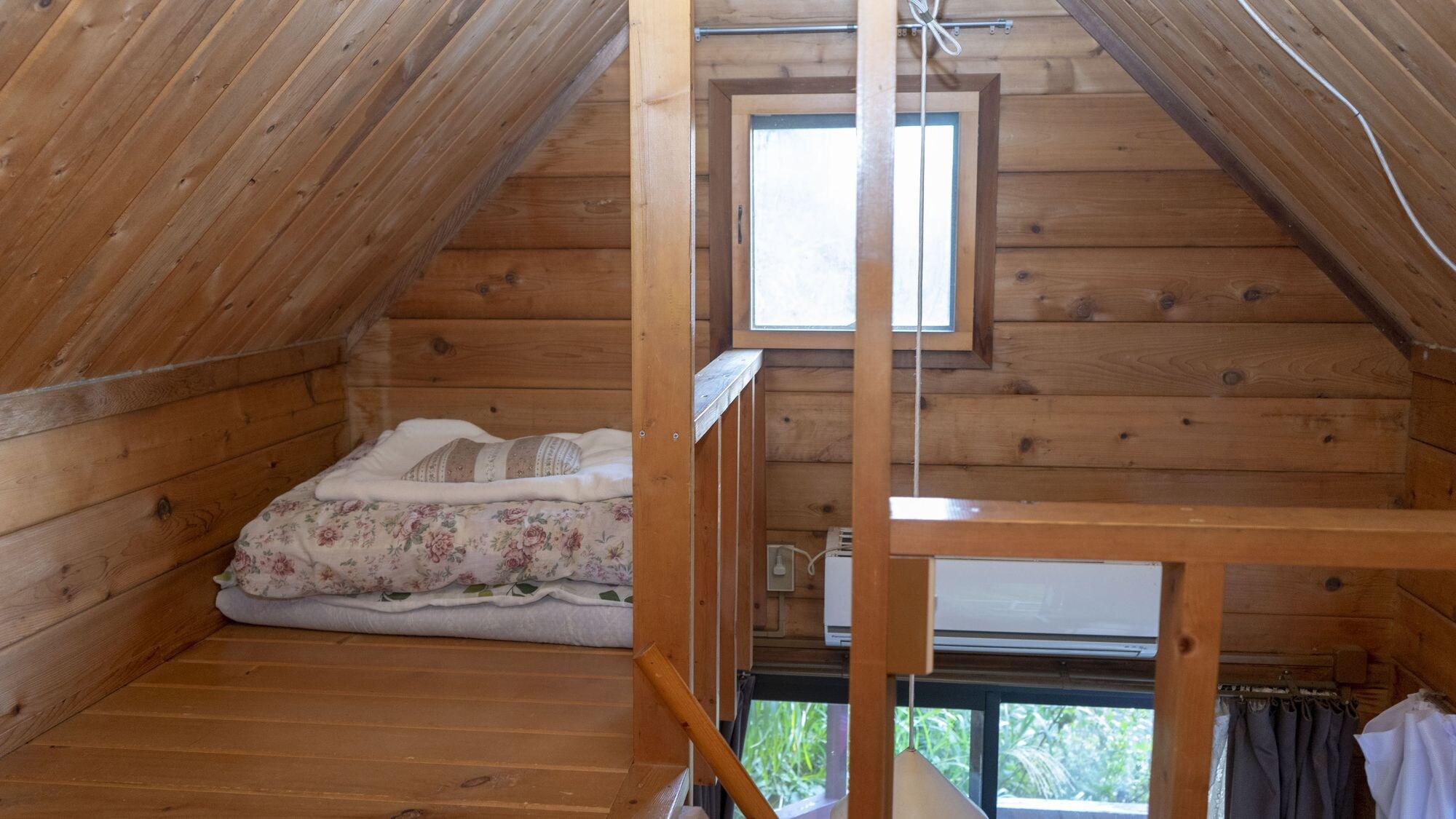 Log house loft bedroom