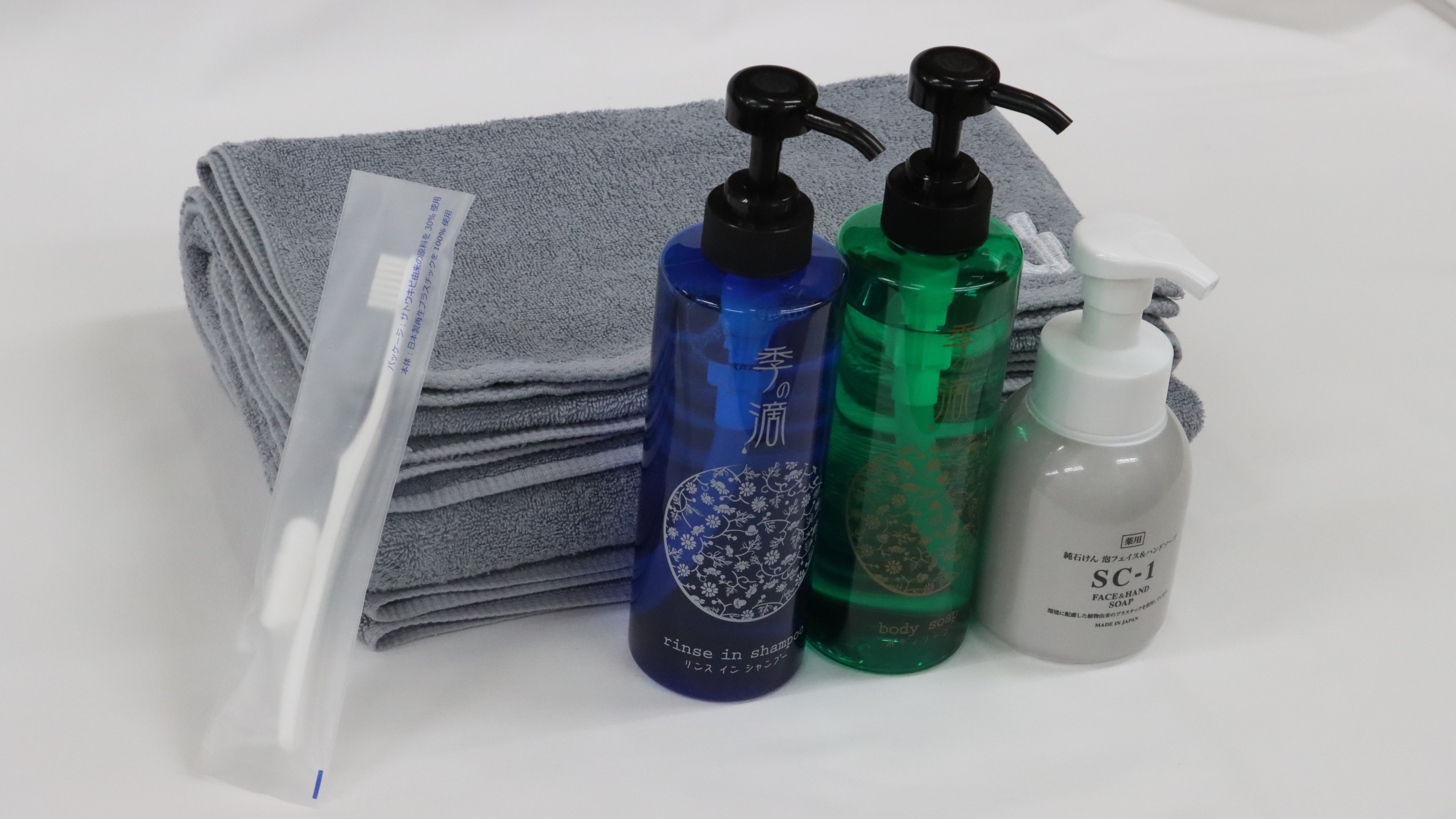 Bathroom amenities [rinse-in shampoo, body soap, hand soap, toothbrush, towel set]