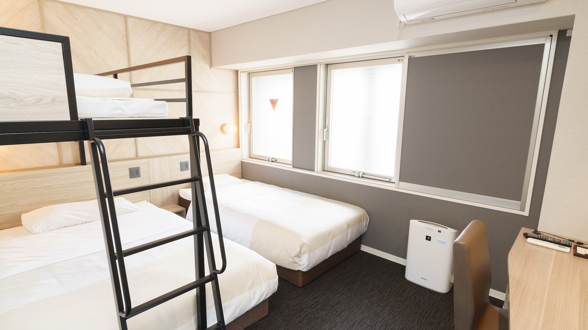 This room comes with two wide double-sized beds and a loft bed that is popular with children.