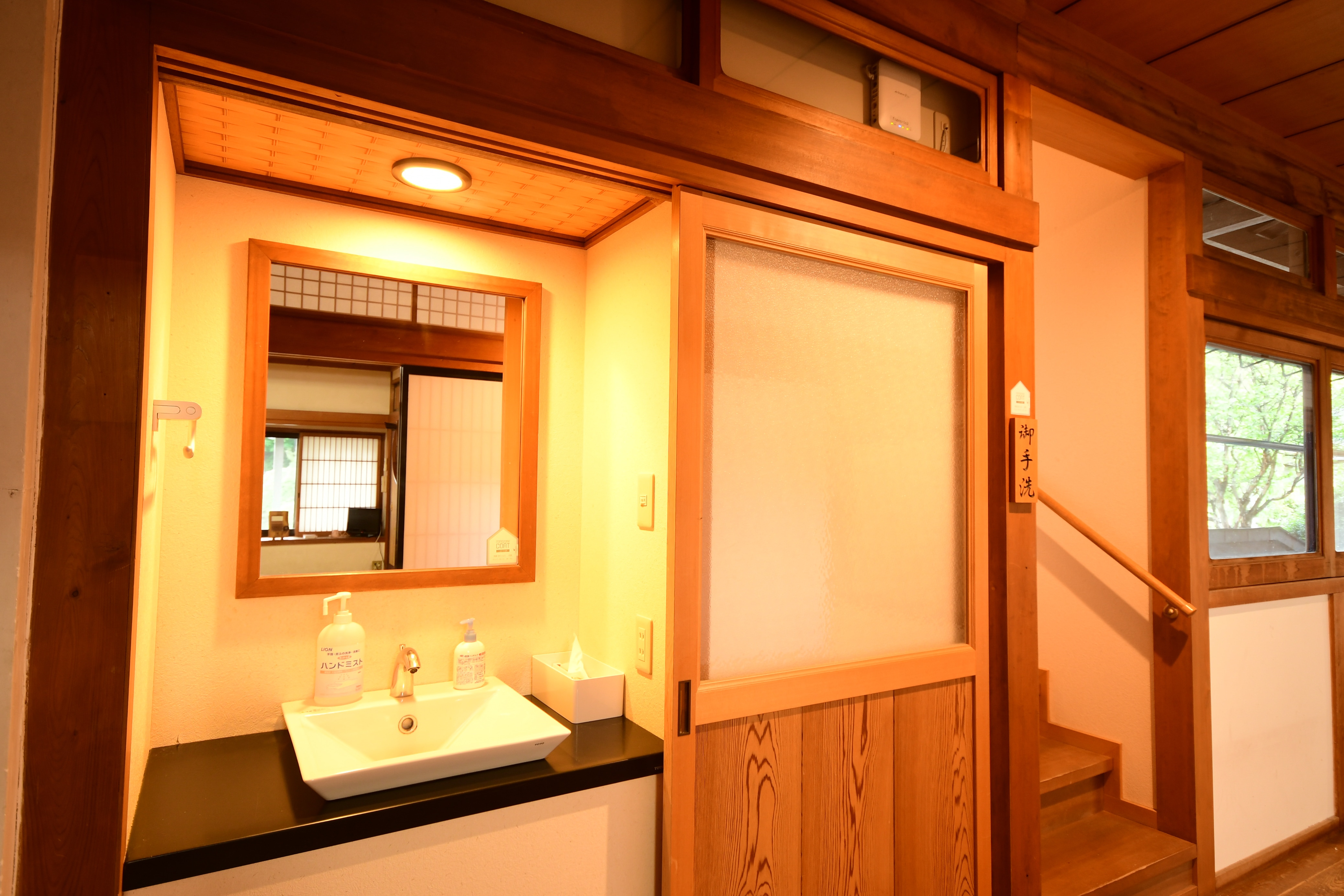 Japanese-style toilet separated by sliding doors (shared)