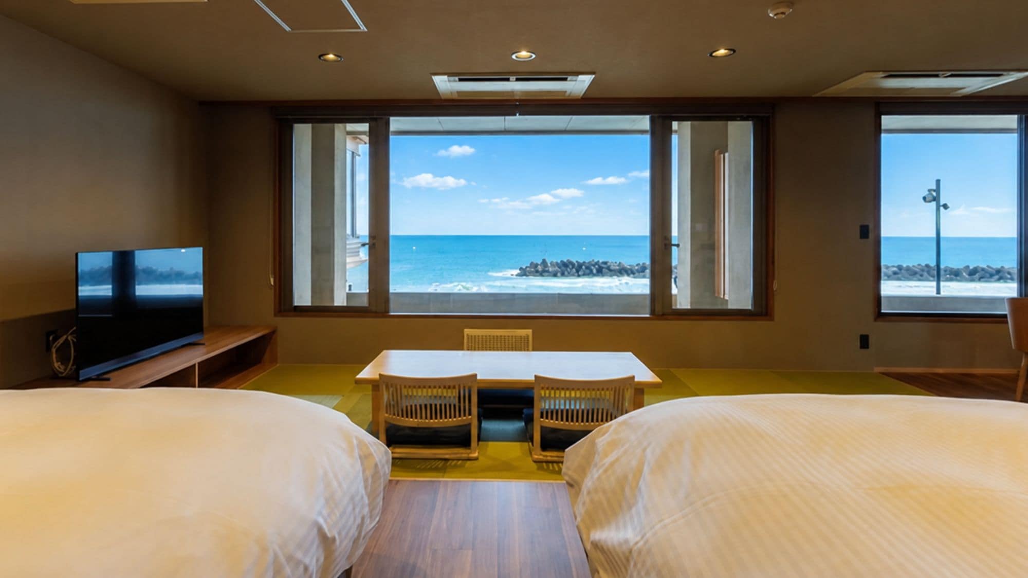 A guest room offering breathtaking views of the Sea of Japan upon waking. (Example)