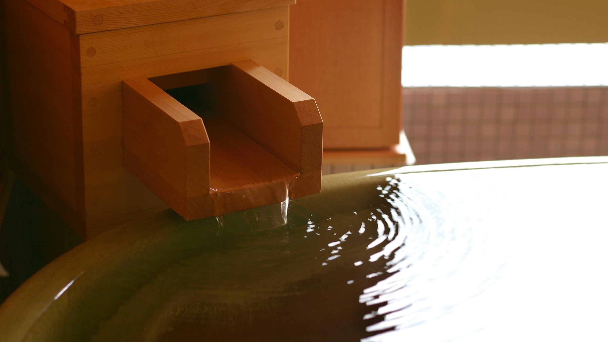 The open-air bath in the guest room is 100% free-flowing from the source (no water added or heated).