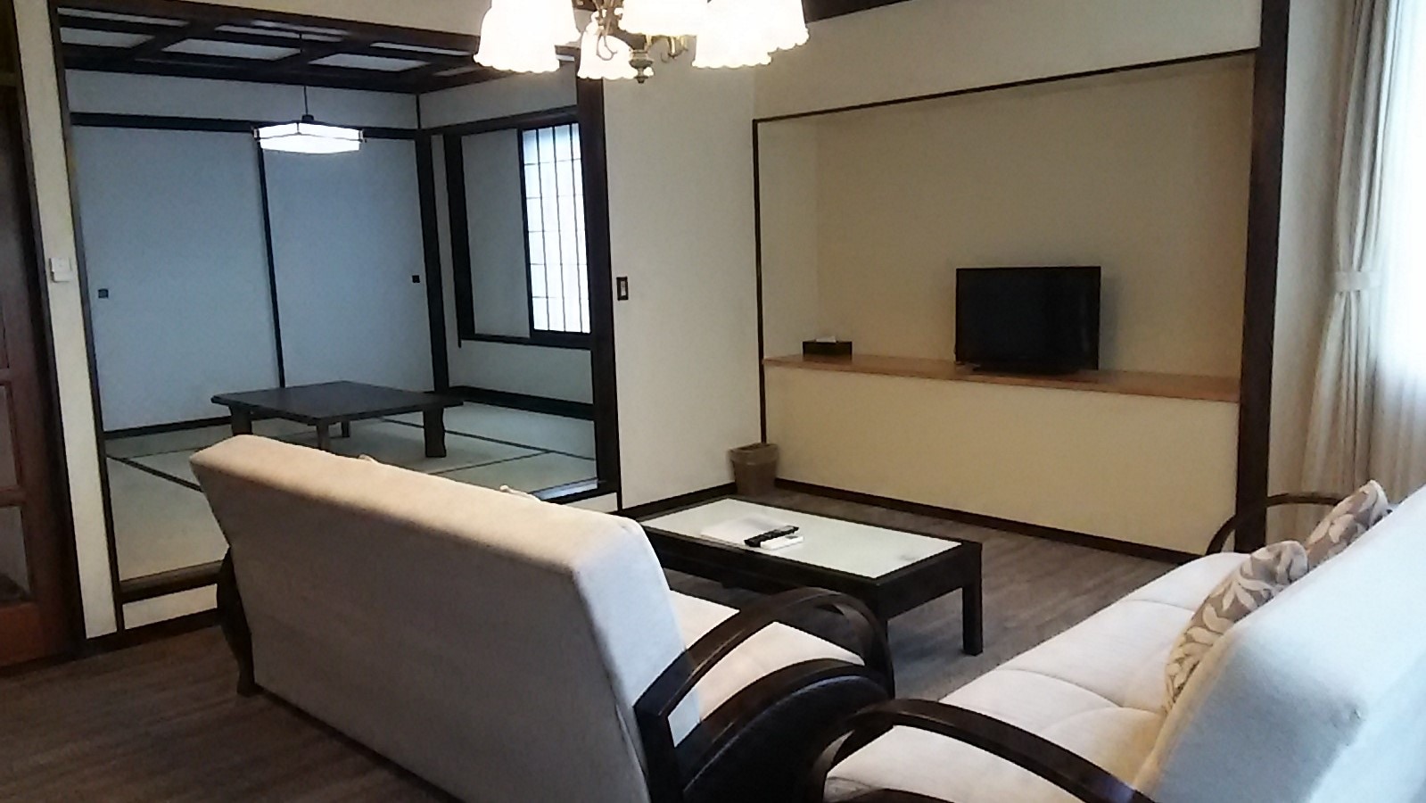 Example of a room with an Izu stone family bath and induction kitchen