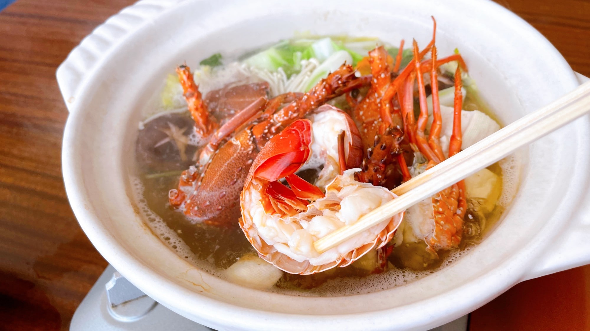 Image of a hotpot filled with spiny lobster