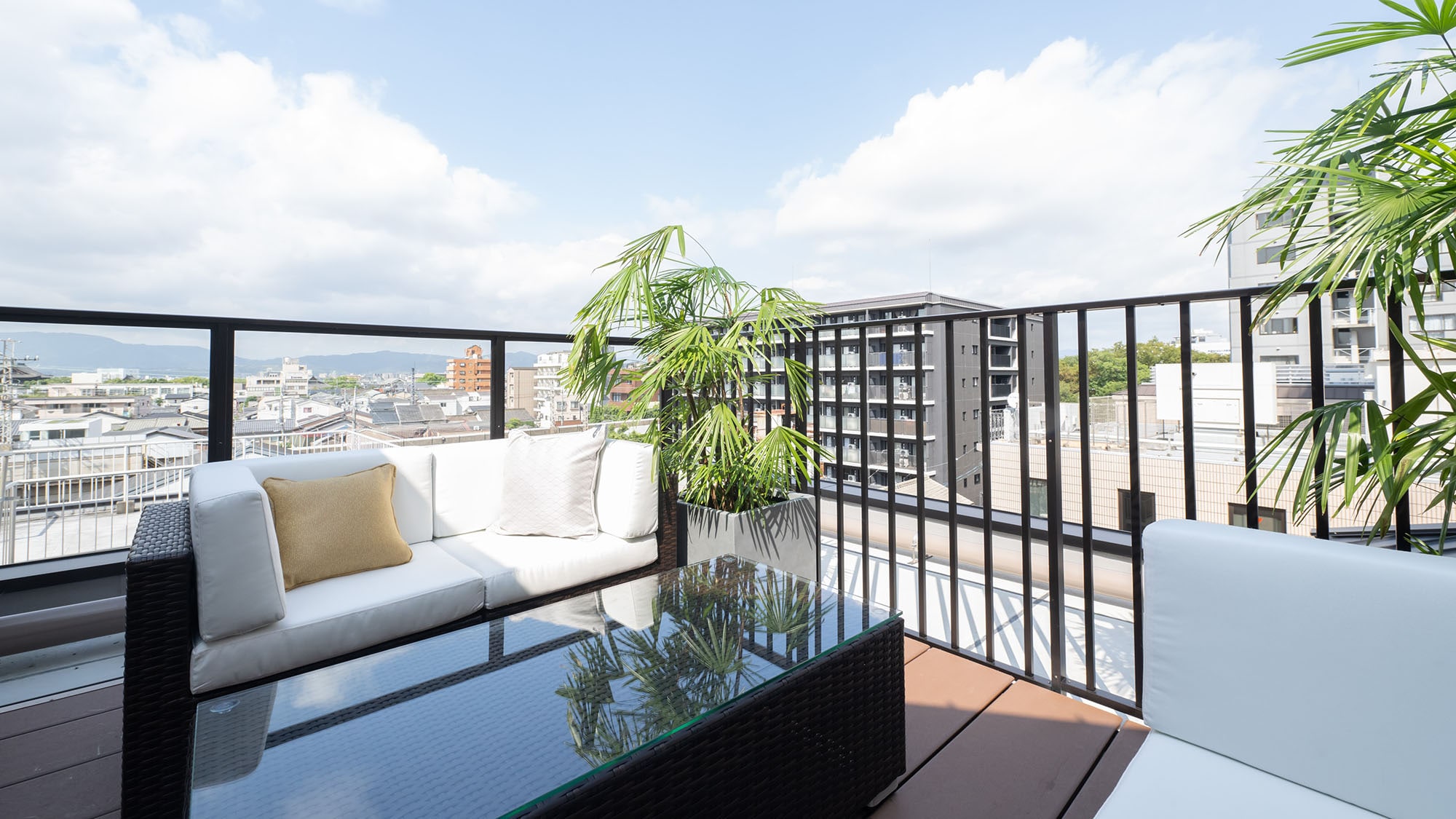 [Family Room B] Equipped with a sofa and coffee table, this room offers plenty of space to relax.