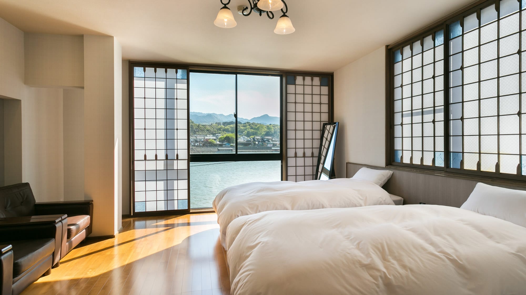 [Room] River view with bright light streaming in through the large windows.