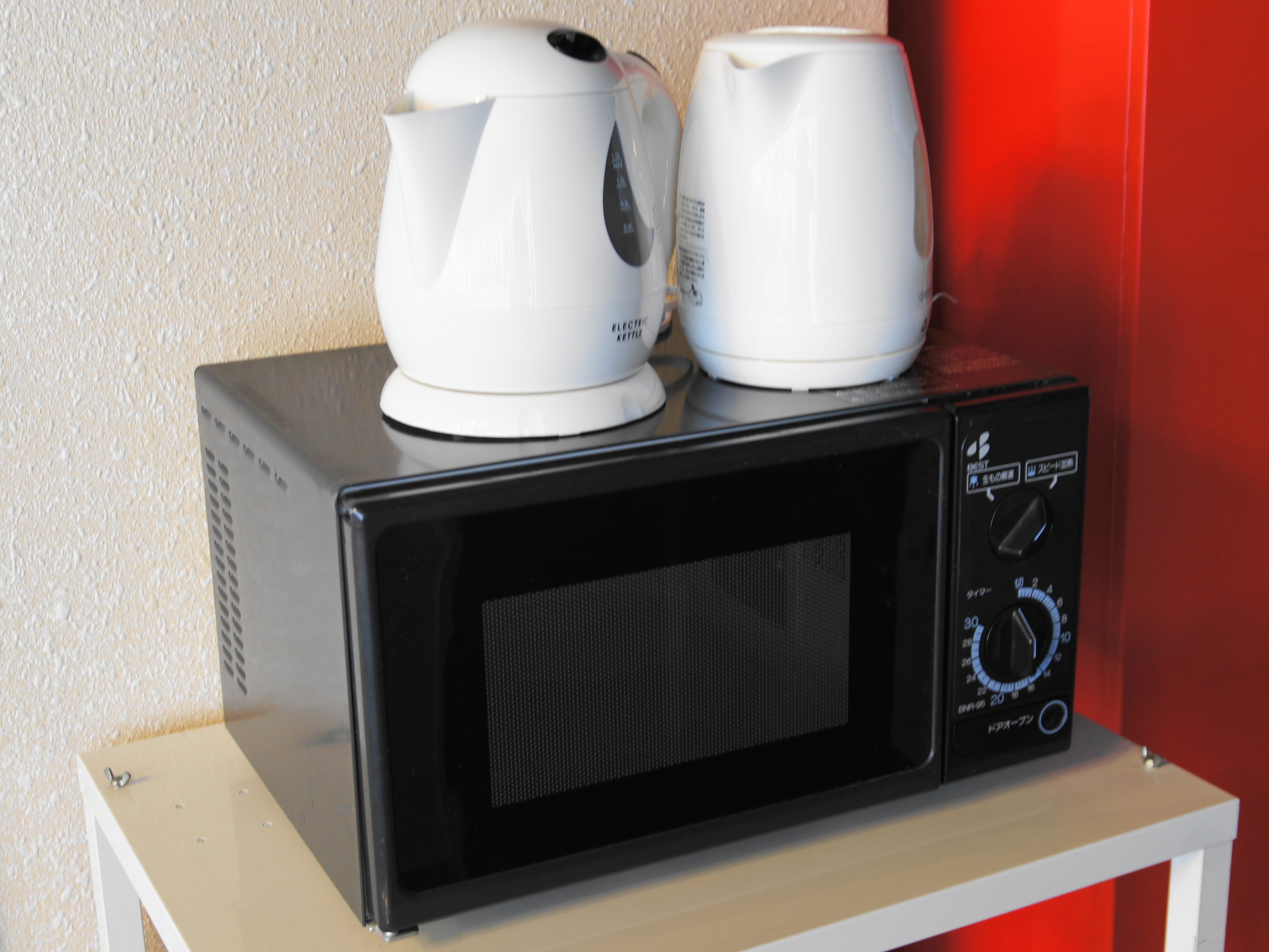 Microwave oven (shared), kettle for boiling water (rental)