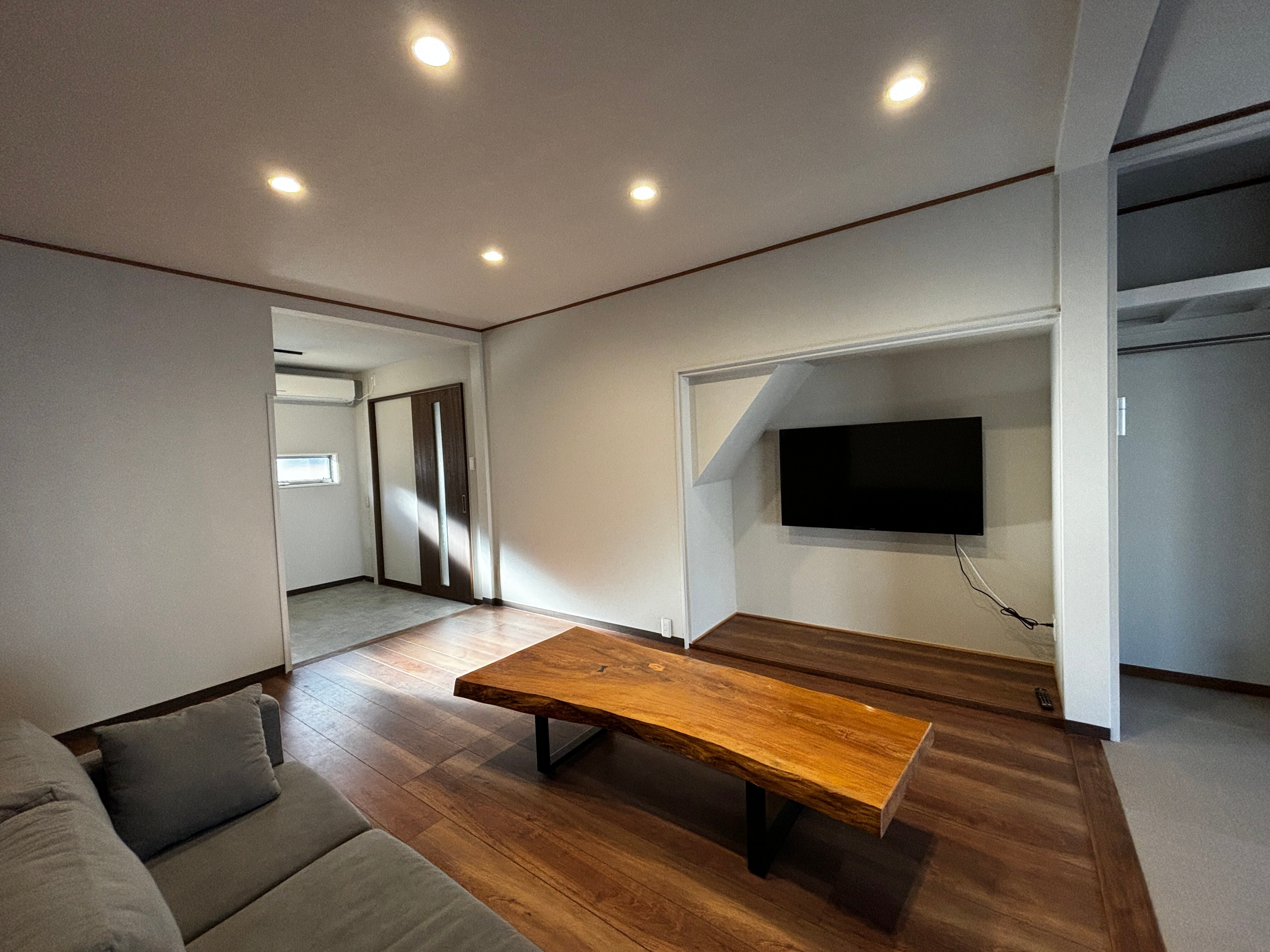 It features a spacious living room and a 50 inch TV.
