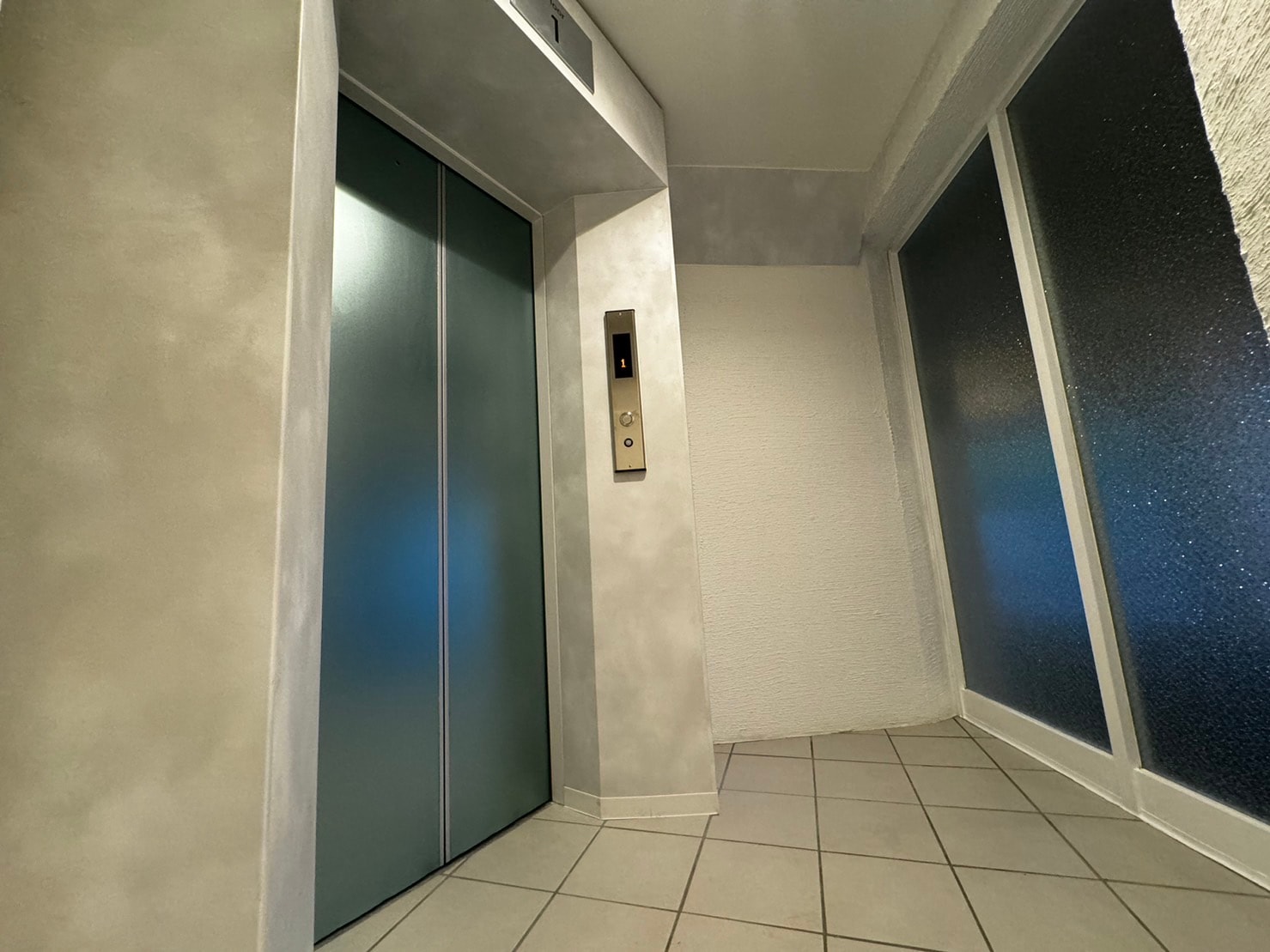 In front of the elevator