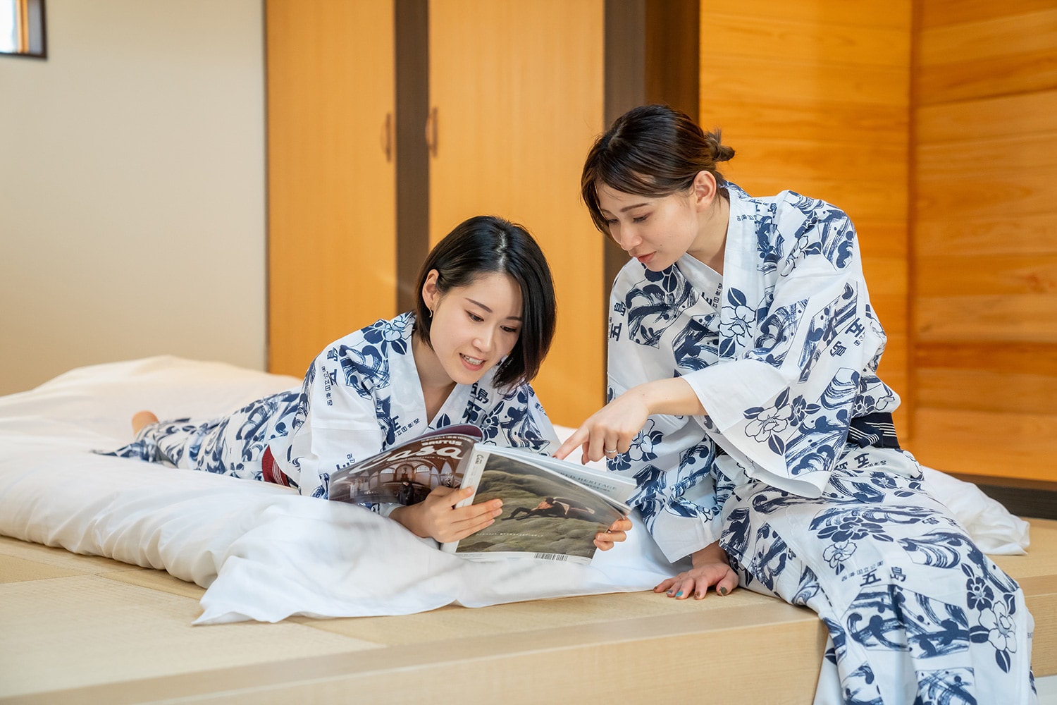 Two people relaxing in the bedroom