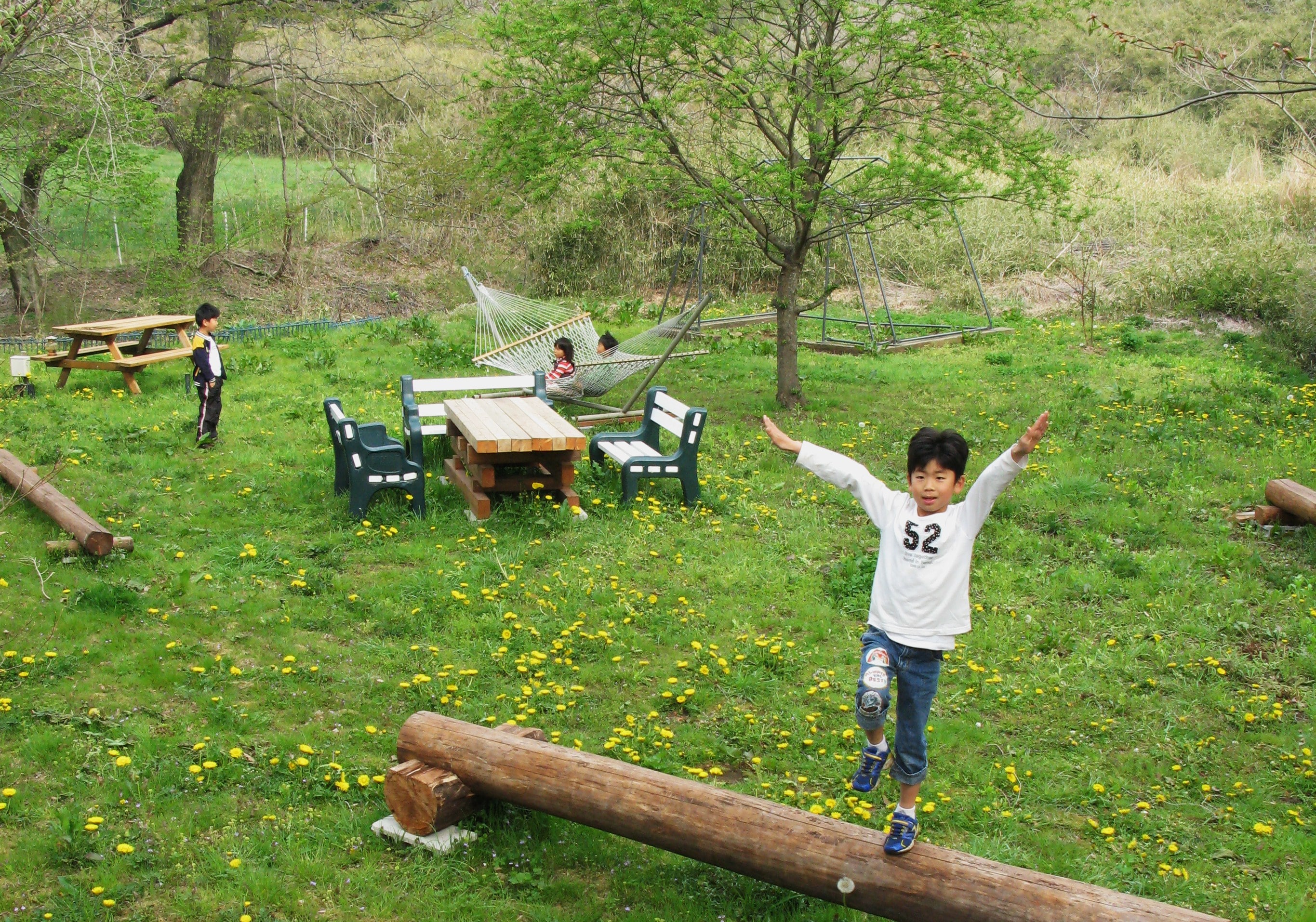 Cheerful children playing in the warm Chausu Forest