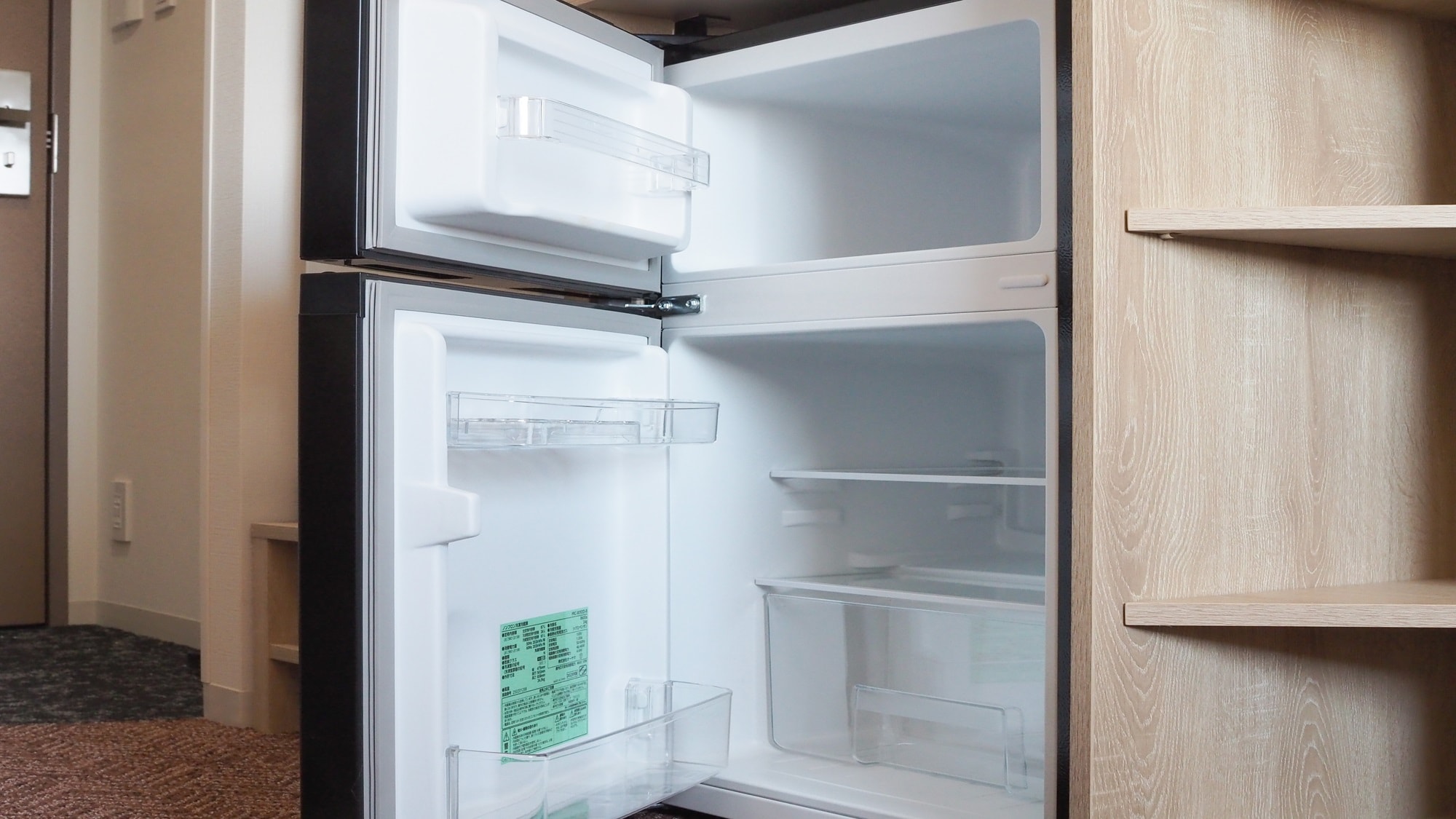 All rooms are equipped with a two-door refrigerator that can also store frozen foods.