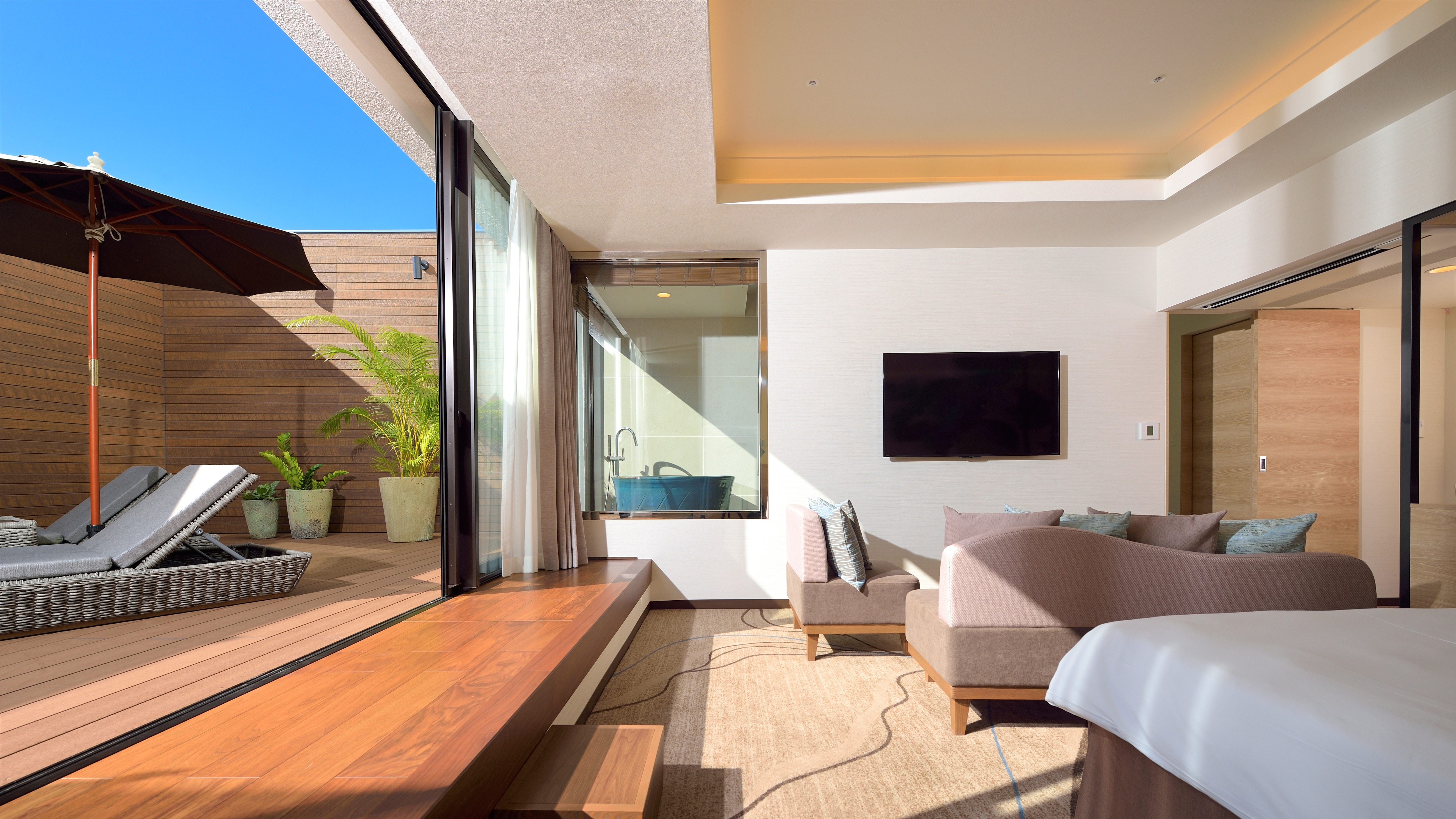 [Terrace Suite 48m2] A suite room with a terrace and direct access to the infinity pool.