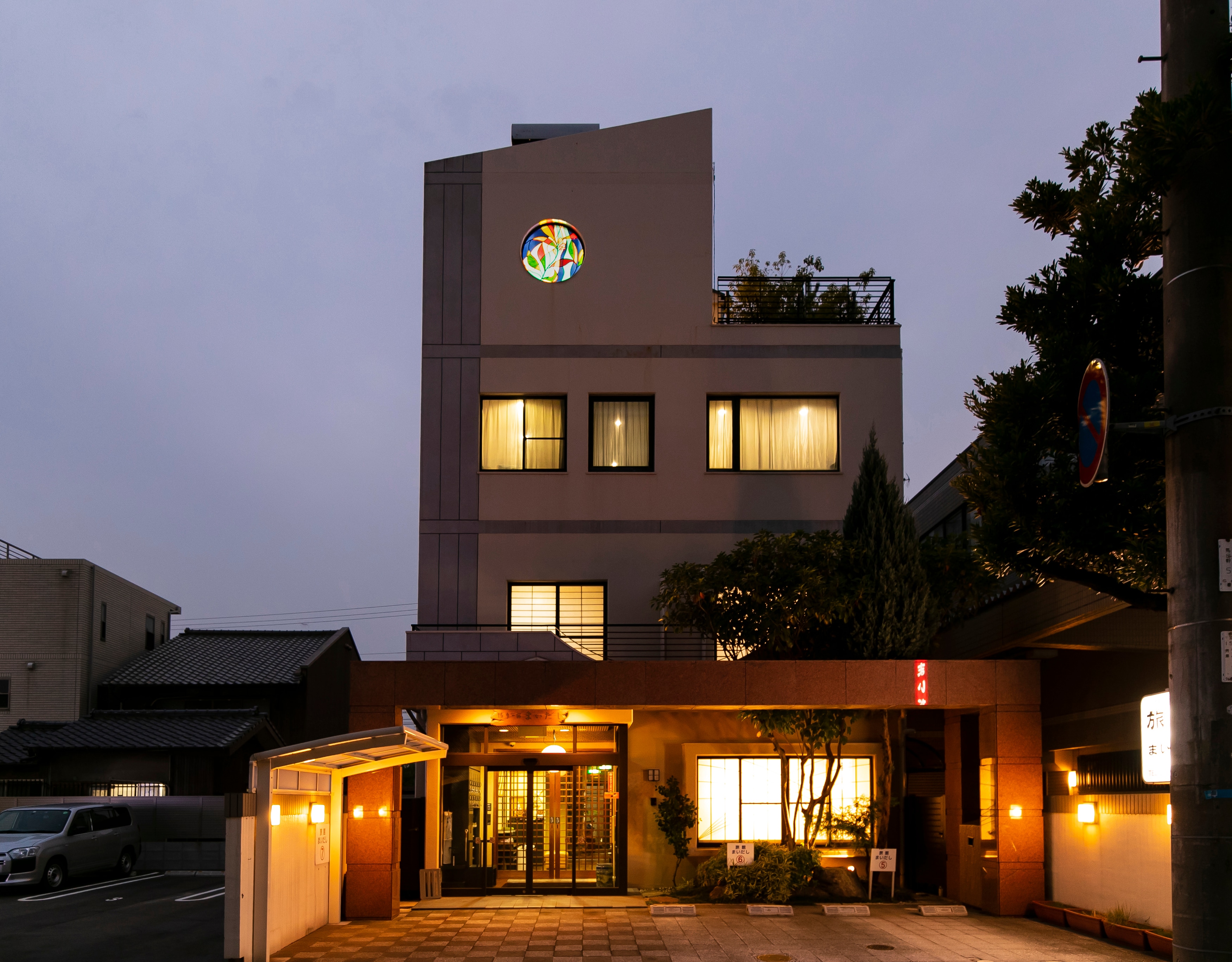 This is the exterior of the inn. At night, the stained glass on the fourth floor comes into view.