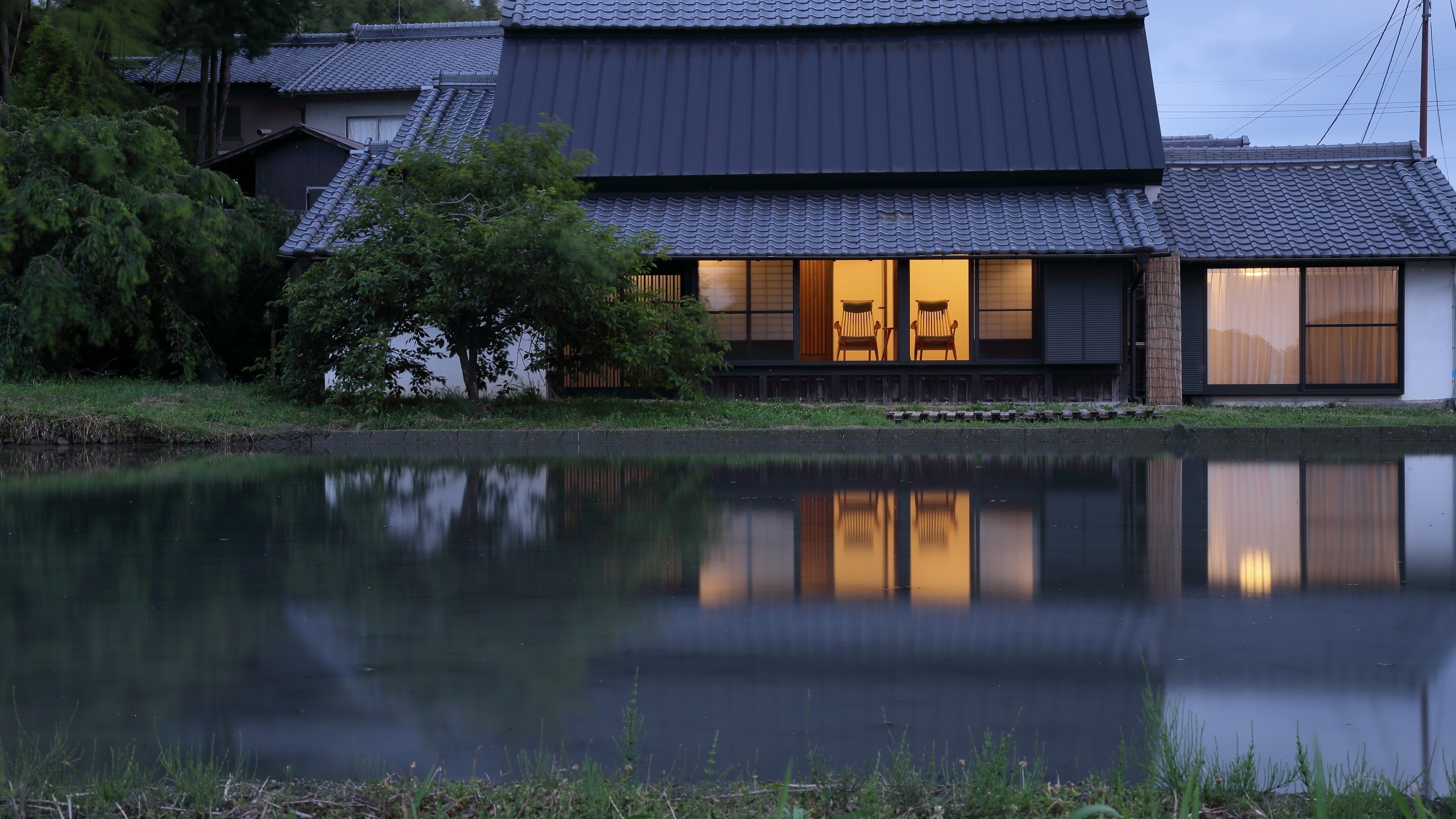 Guest room building reflected in the rice fields approaching dusk