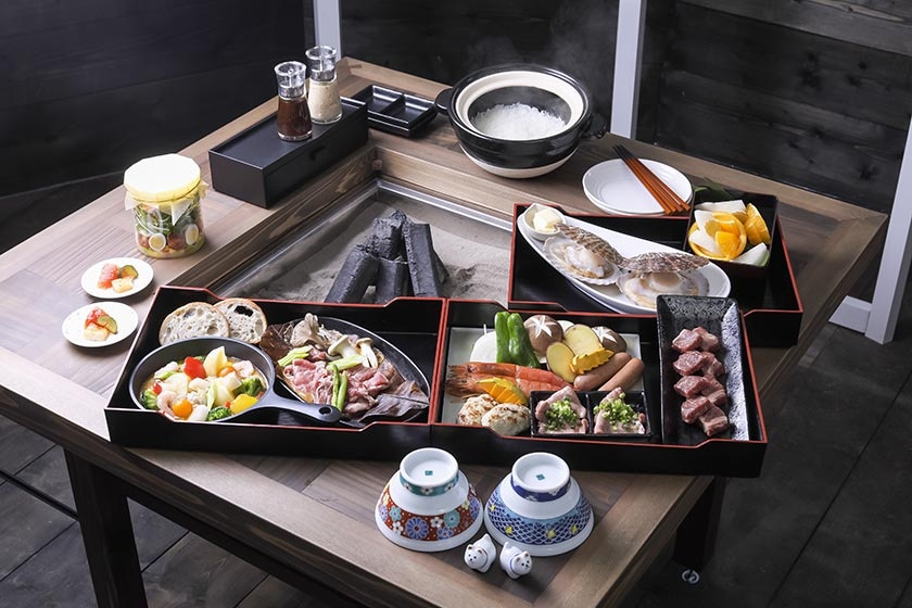 Meals are served around a charcoal hearth in a private gazebo on the premises.