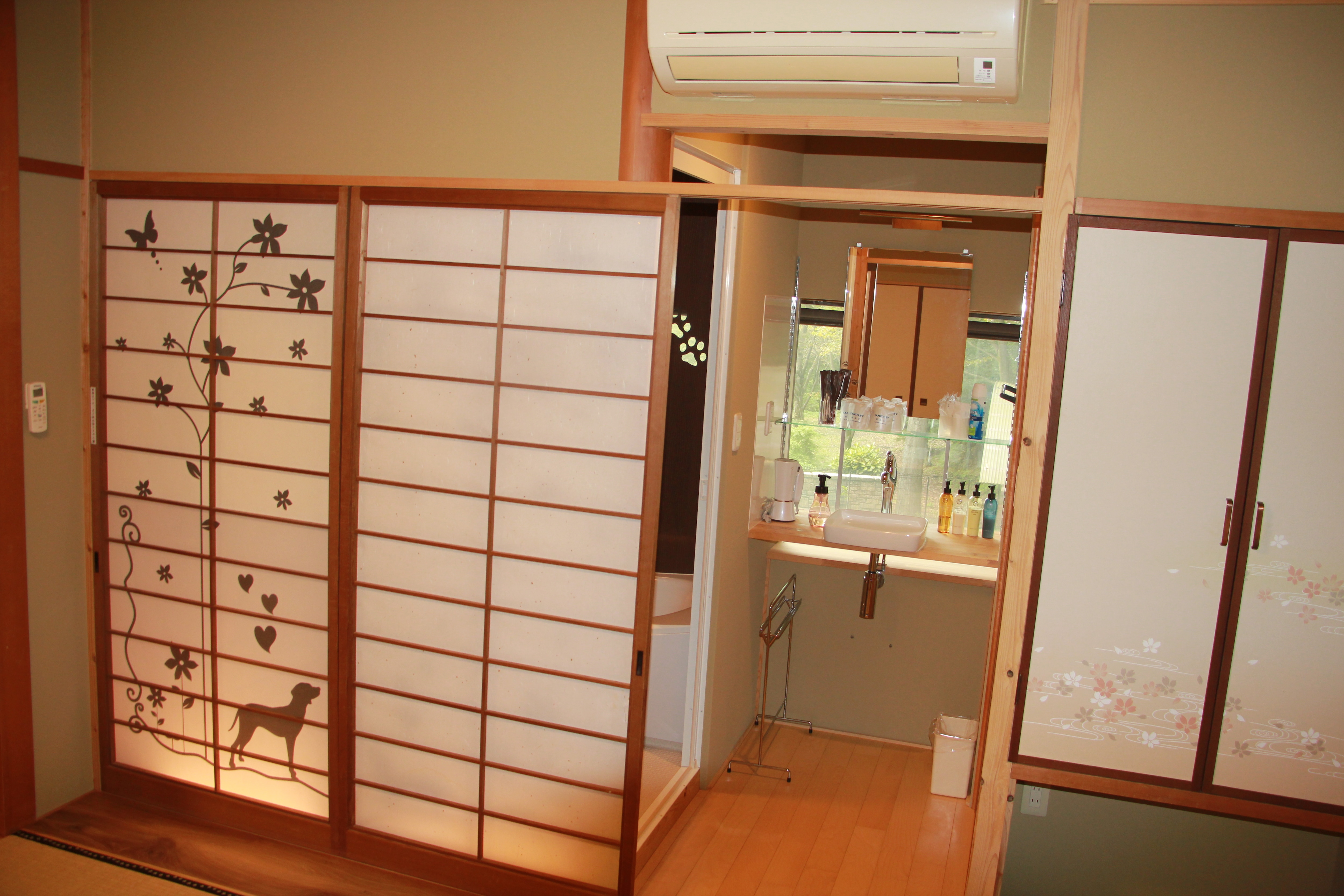 Two adjoining 16-tatami Japanese-style rooms, washroom and unit bath area