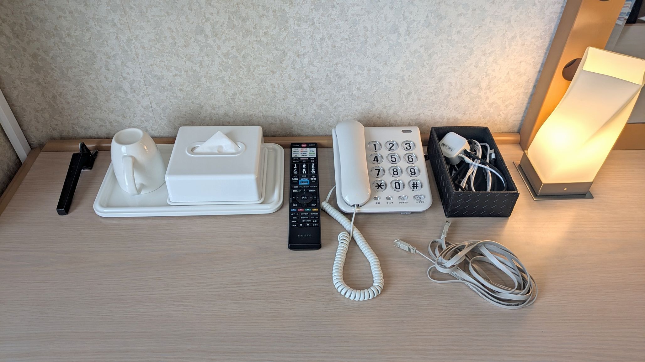 A smartphone charger is provided on the desk!