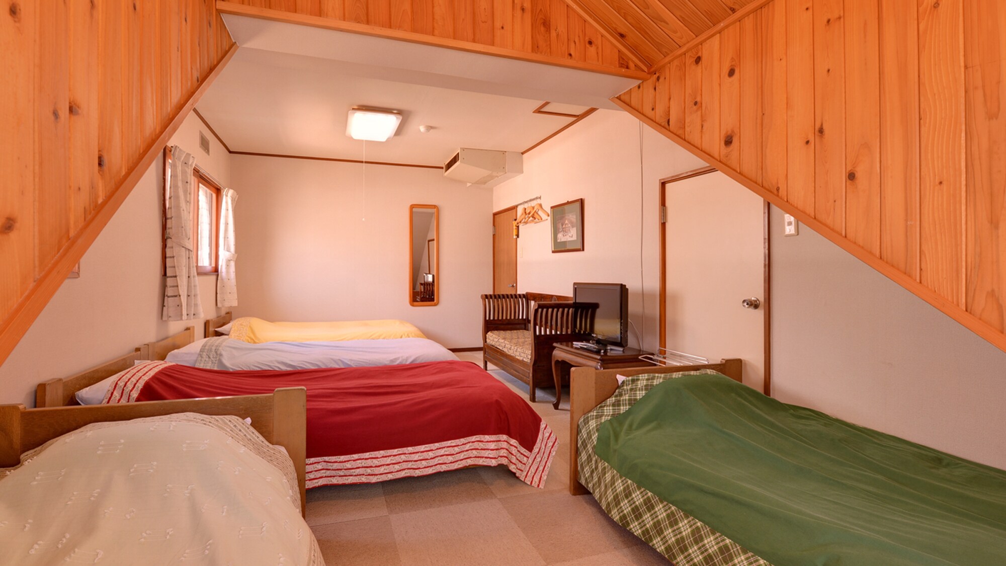 * Western-style room with 5 beds (example of a guest room) / Perfect for families and groups. Relax in the gentle warmth of the wood.