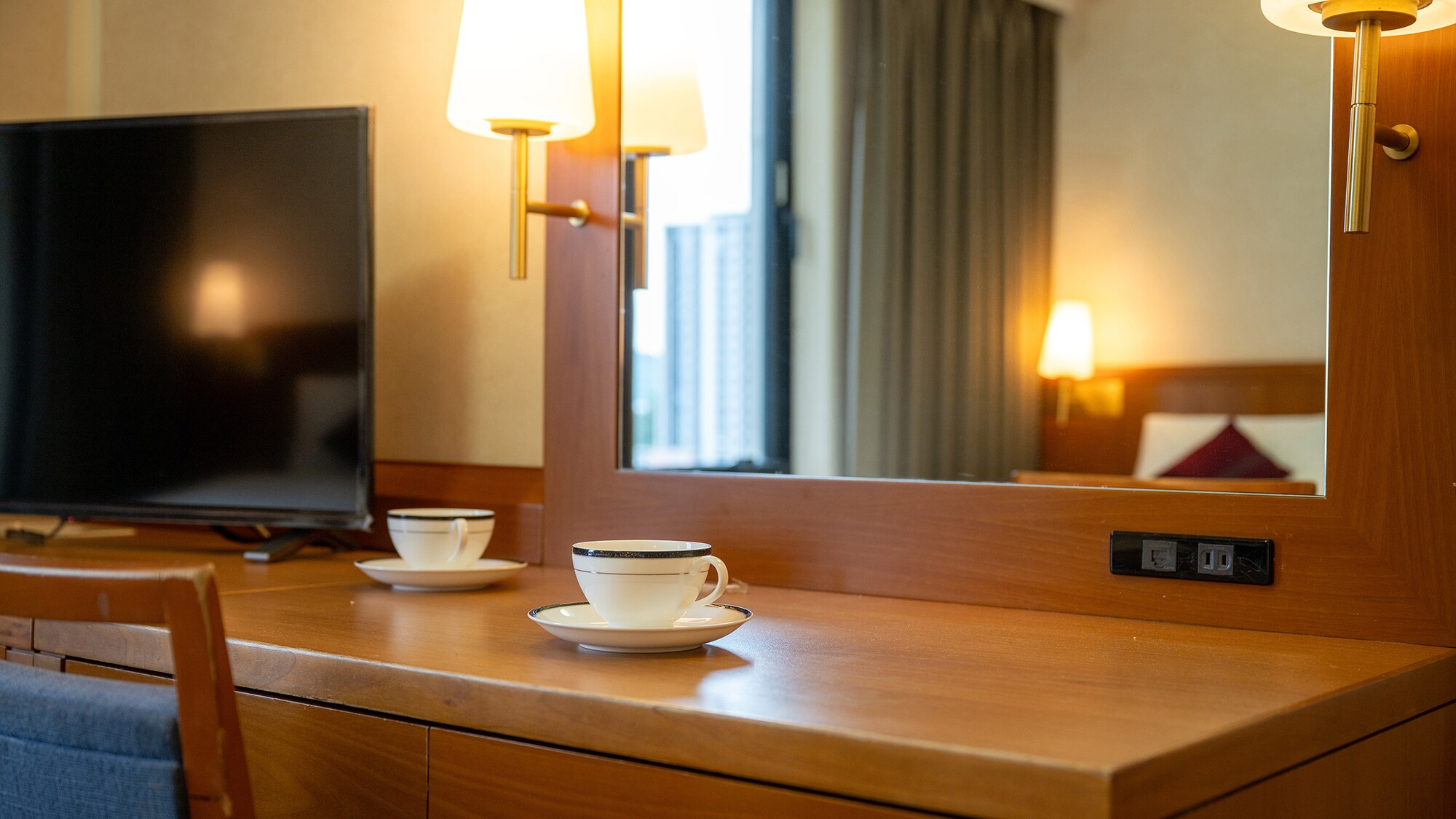 A warm, comforting light illuminates the room. Each room is equipped with a large mirror for easy grooming.